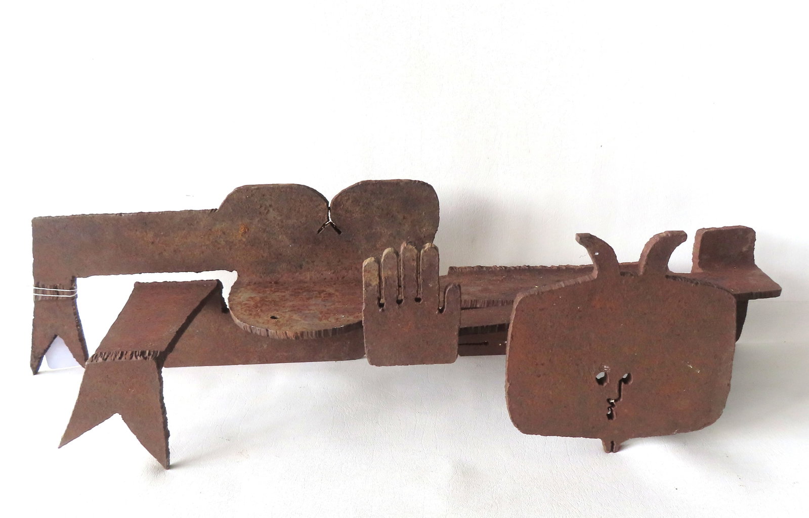Albert Leon Wilson (American, 1920-1999), An unusual abstract iron sculpture of a man in a bent (1 of 10)