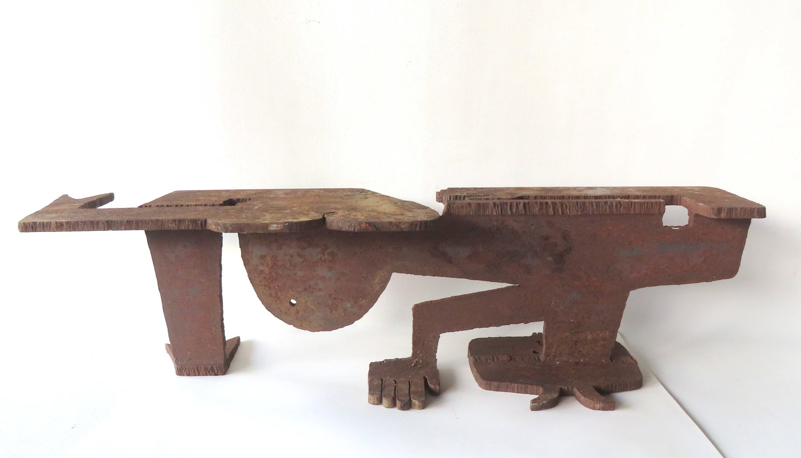 Albert Leon Wilson (American, 1920-1999), An unusual abstract iron sculpture of a man in a bent: Albert Leon Wilson (American, 1920-1999), An unusual abstract iron sculpture of a man in a bent forward position and other abstract features including fish tails. Signed "Wilson 1965". Good condition.