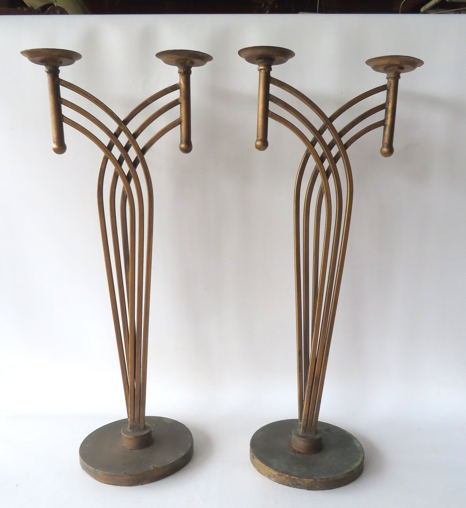 A pair of hand made gilded iron Art Deco theatrical or hotel lobby displays, probably for holding: A pair of hand made gilded iron Art Deco theatrical or hotel lobby displays, probably for holding plants or ashtrays, circa 1930-50. Both in original gilded paint and in good condition. Note that each