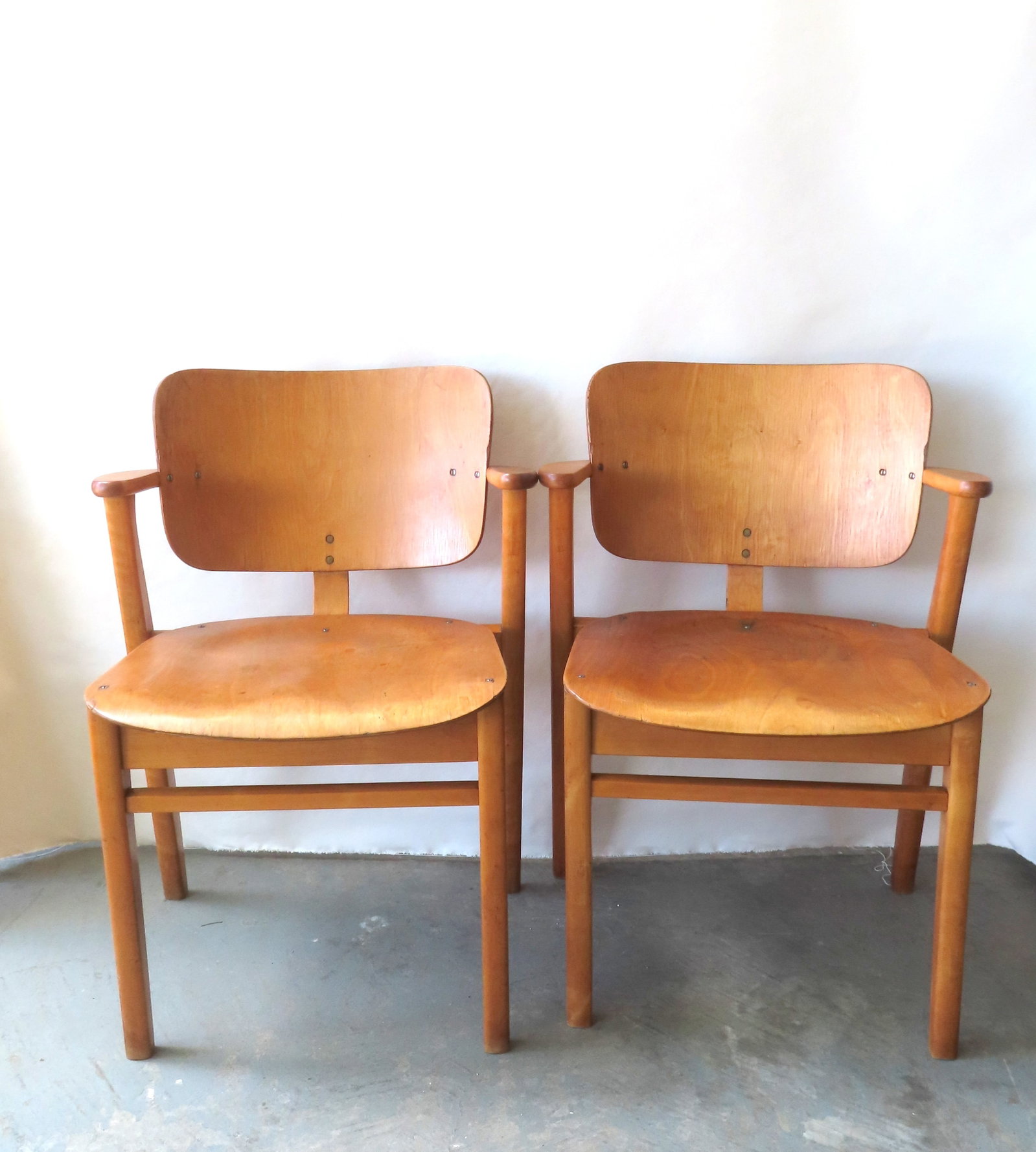 A pair of Model Domus chairs, designed by noted Finnish designer Ilmari Tapiovaara, layered birch (1 of 11)