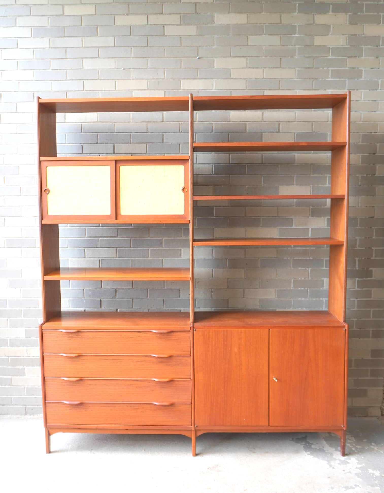 A mid-century modern style Norwegian teakwood sectonal wall unit composed of 2 sections. The left (1 of 15)