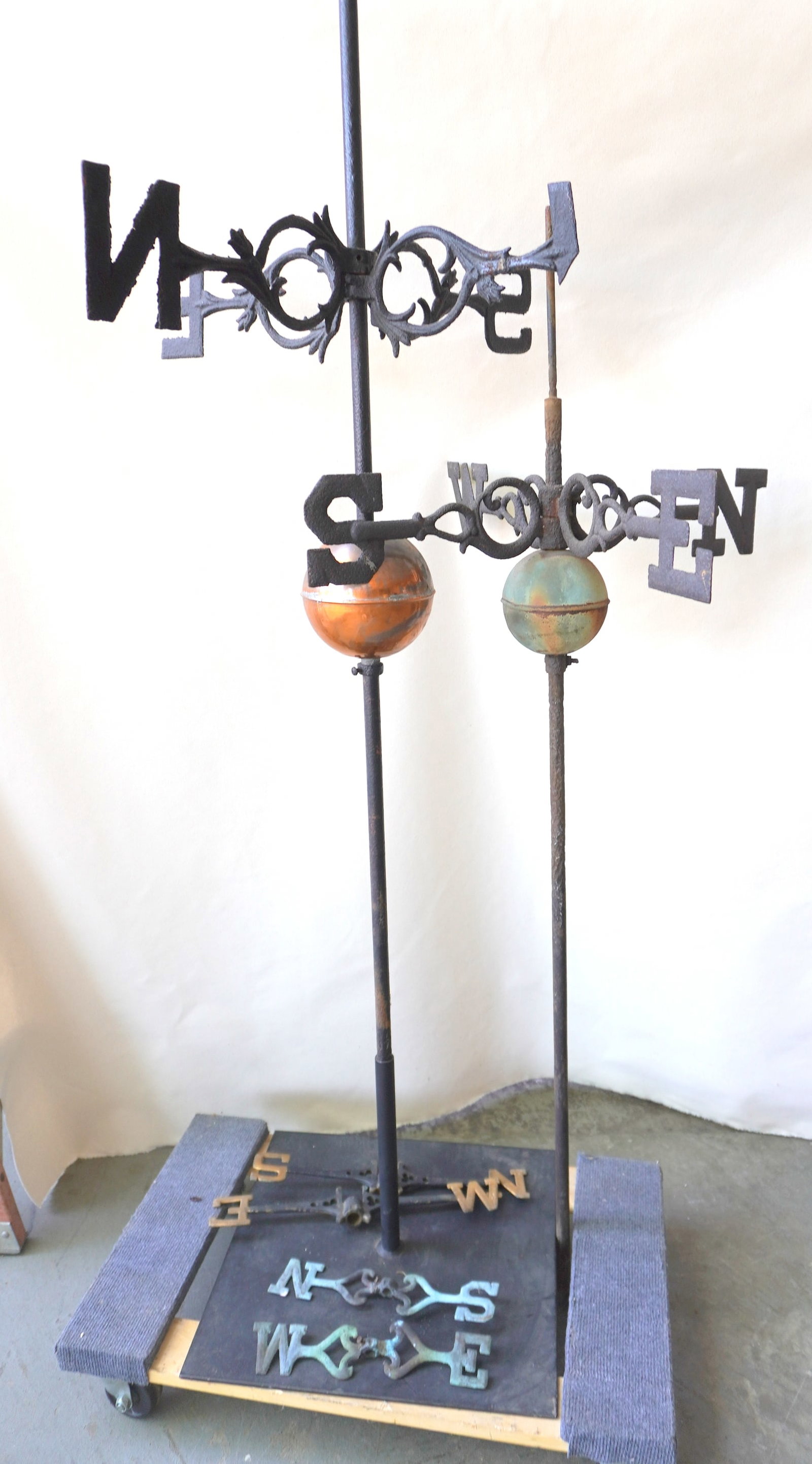 Grouping of four 19th century cast iron weathervane directionals, 2 with copper orbs that are (1 of 13)