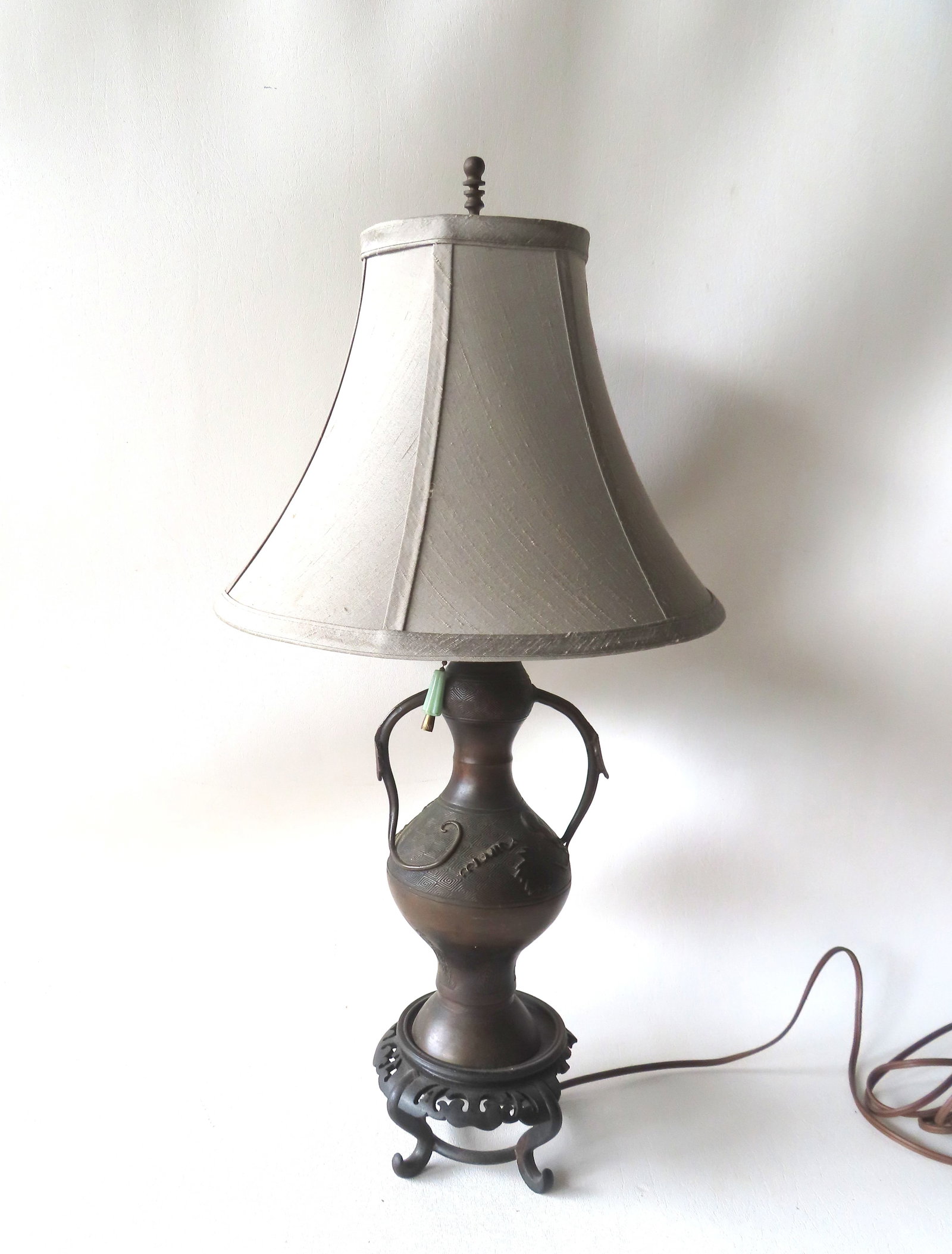 An oriental 19th century bronze vase, converted to a table lamp attached to a carved wooden base. (1 of 9)