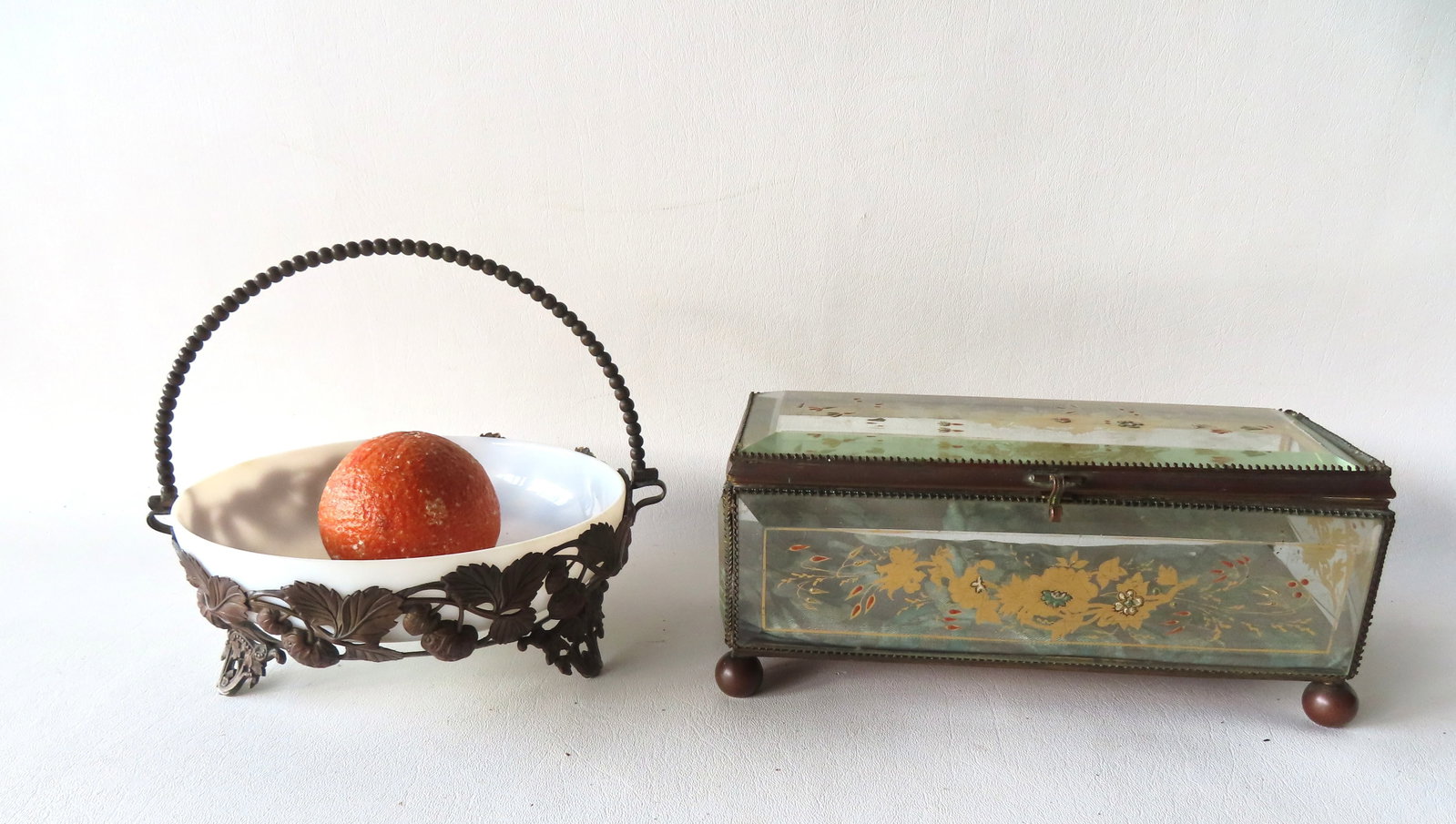Two decorative 19th century collectibles including: A rectangular shaped French jewelry casket with: Two decorative 19th century collectibles including: A rectangular shaped French jewelry casket with beveled glass sides and lid supported by brass borders, and having the glass panels decorated with g