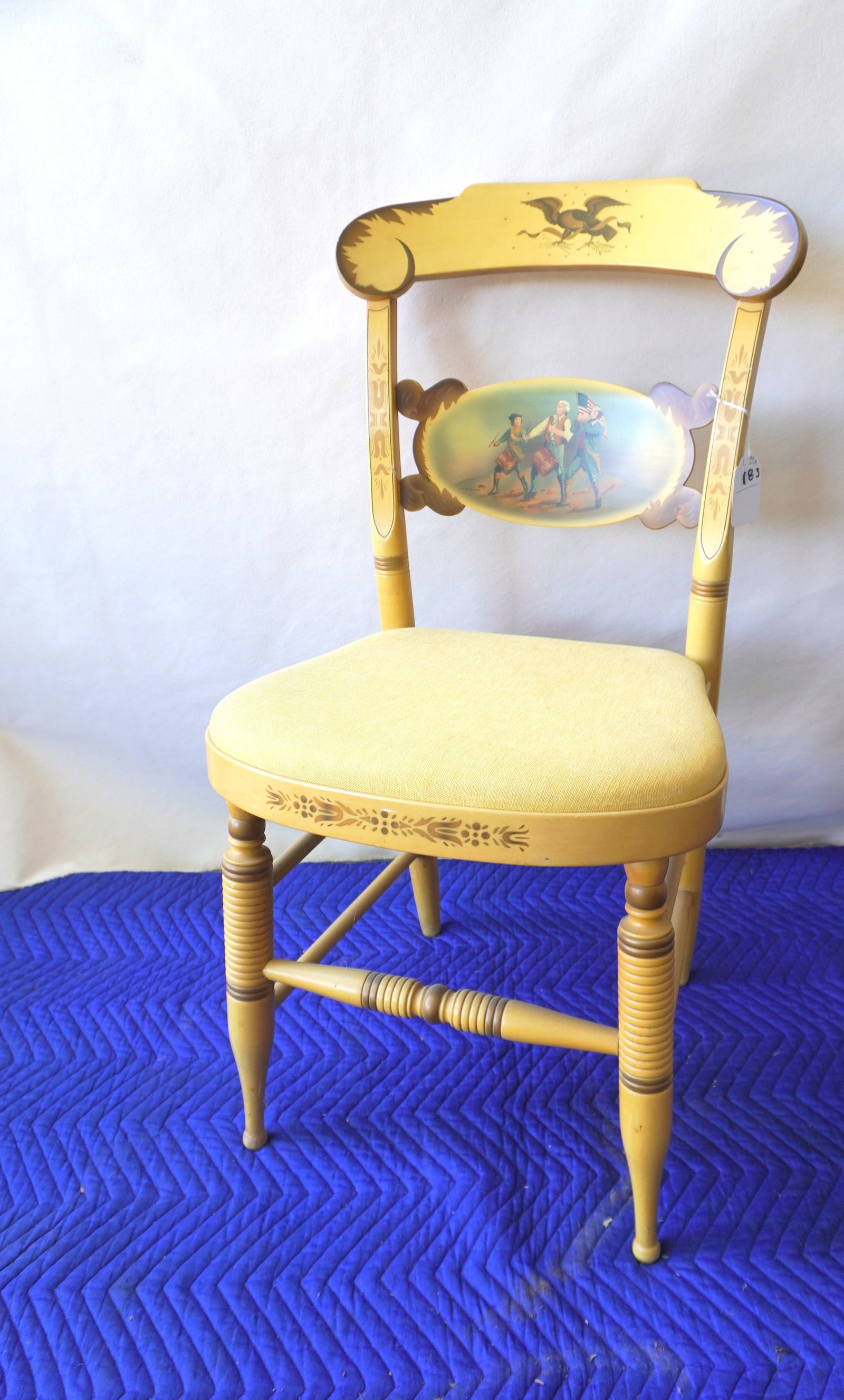 Patriotic stenciled bicentennial Hitchcock chair, titled on reverse "The Spirit of '76" and signed: Patriotic stenciled bicentennial Hitchcock chair, titled on reverse "The Spirit of '76" and signed "L.Hitchcock. Hitchcocksville. Conn. Warranted". Original paint and seat. Very good condition. These 