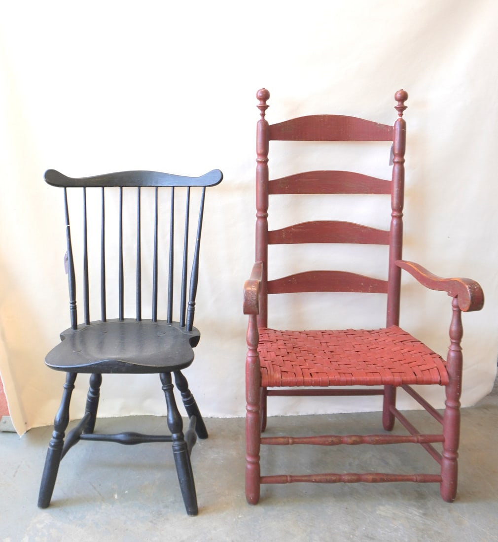 Two early country chairs, both 18th century.: Two early country chairs. The first a fan-back Windsor in old black paint, good structural condition, late 18th century; the second, a ladder back arm chair with sausage turned posts and pronounced ba