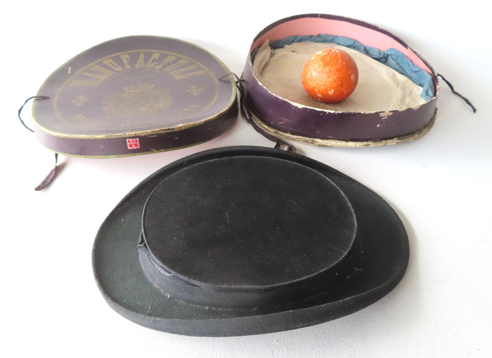 A collapsible French silk top hat in original box marked on interior of hat "Chapelier Granoble (1 of 8)