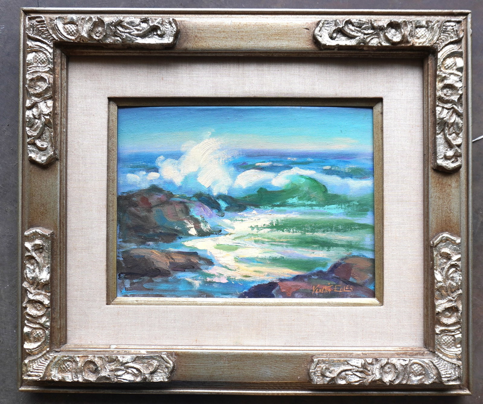 Venetia Epler, California (Hollywood scenic artist), 1912-2005. O/B Colorful seascape with waves: Venetia Epler, California (Hollywood scenic artist), 1912-2005. O/B Colorful seascape with waves breaking against rocky coastline, very good condition circa 1950-70 - total frame size 20 1/4" x 17 1/4