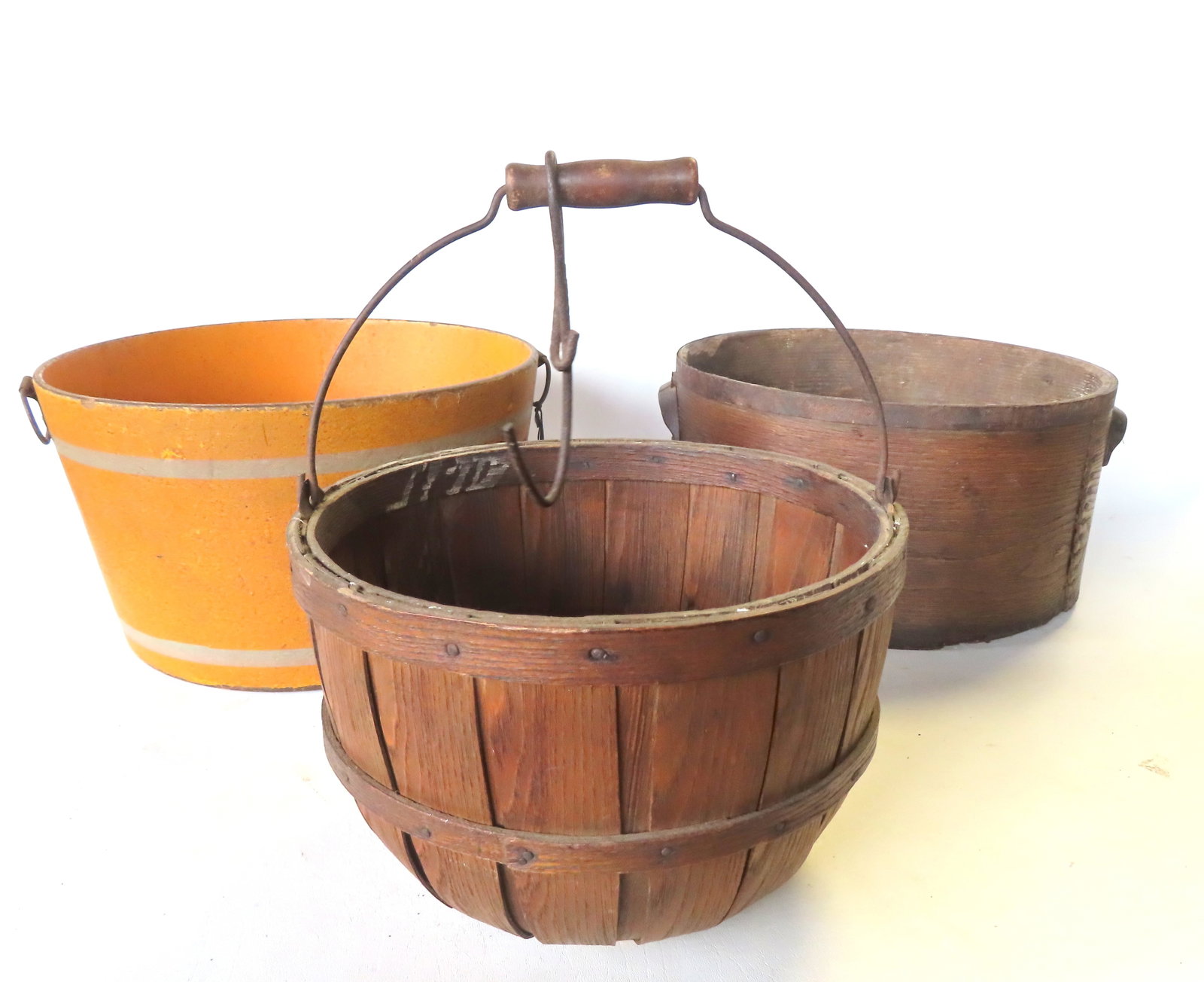 Three country kitchen collectibles, 19th century, including: An apple basket with bale handle and (1 of 10)