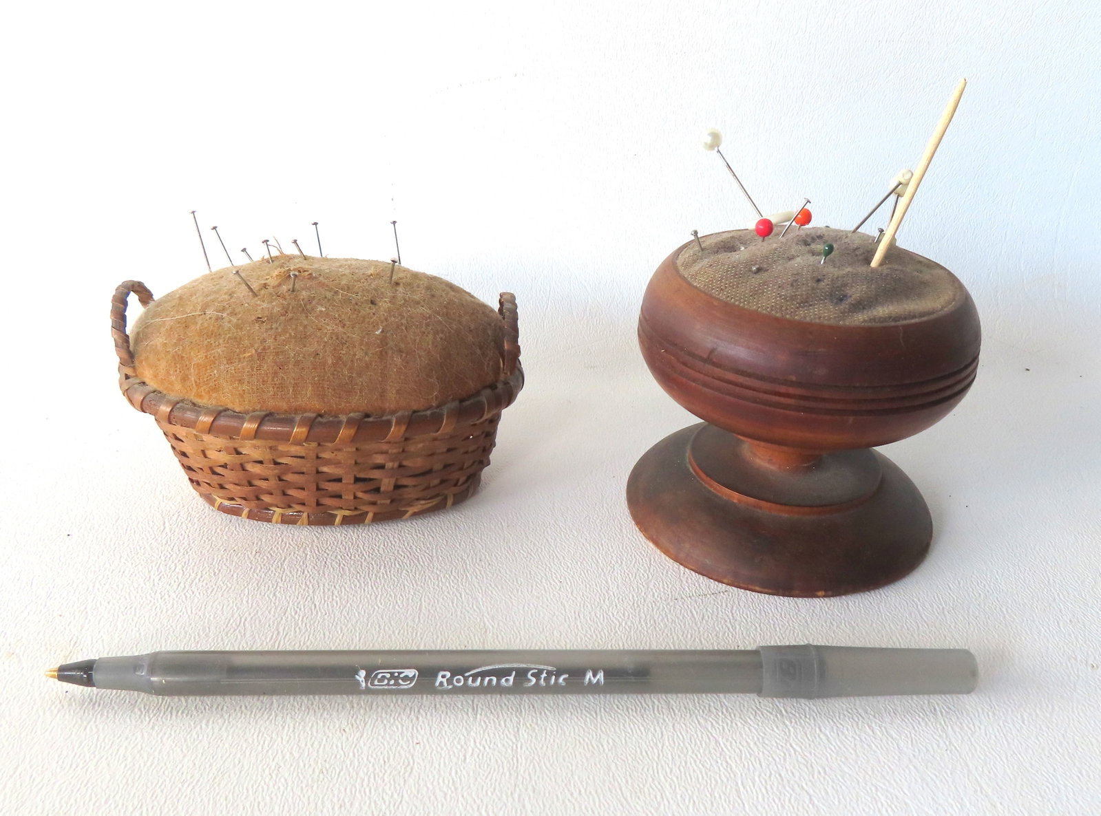 Two early pin cushions: The first a miniature double handed woven splint basket pin cushion - mid (1 of 6)