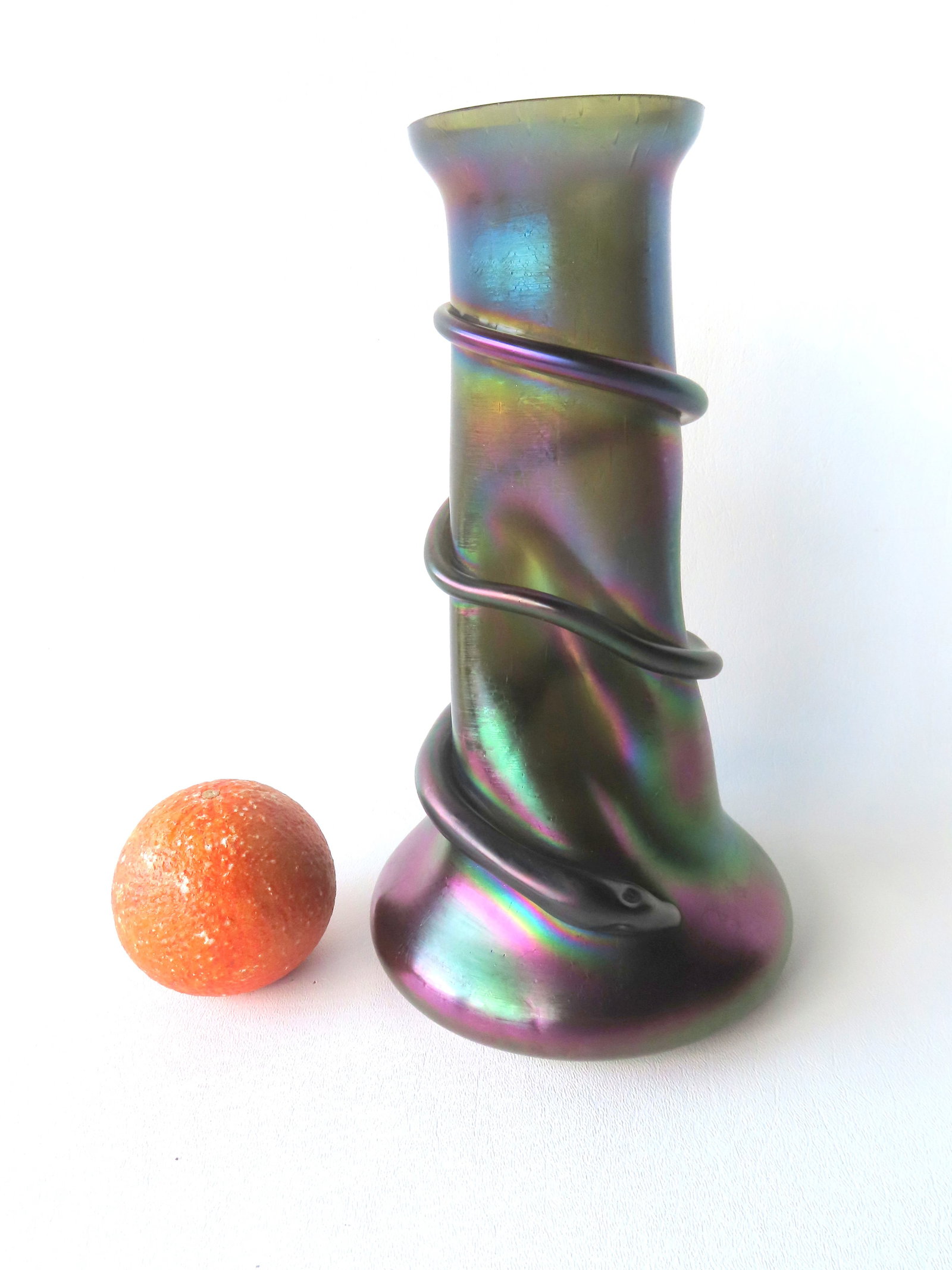 A Bohemian art glass iridescent dark green vase with snake wrapped around pinched body. Probably (1 of 7)