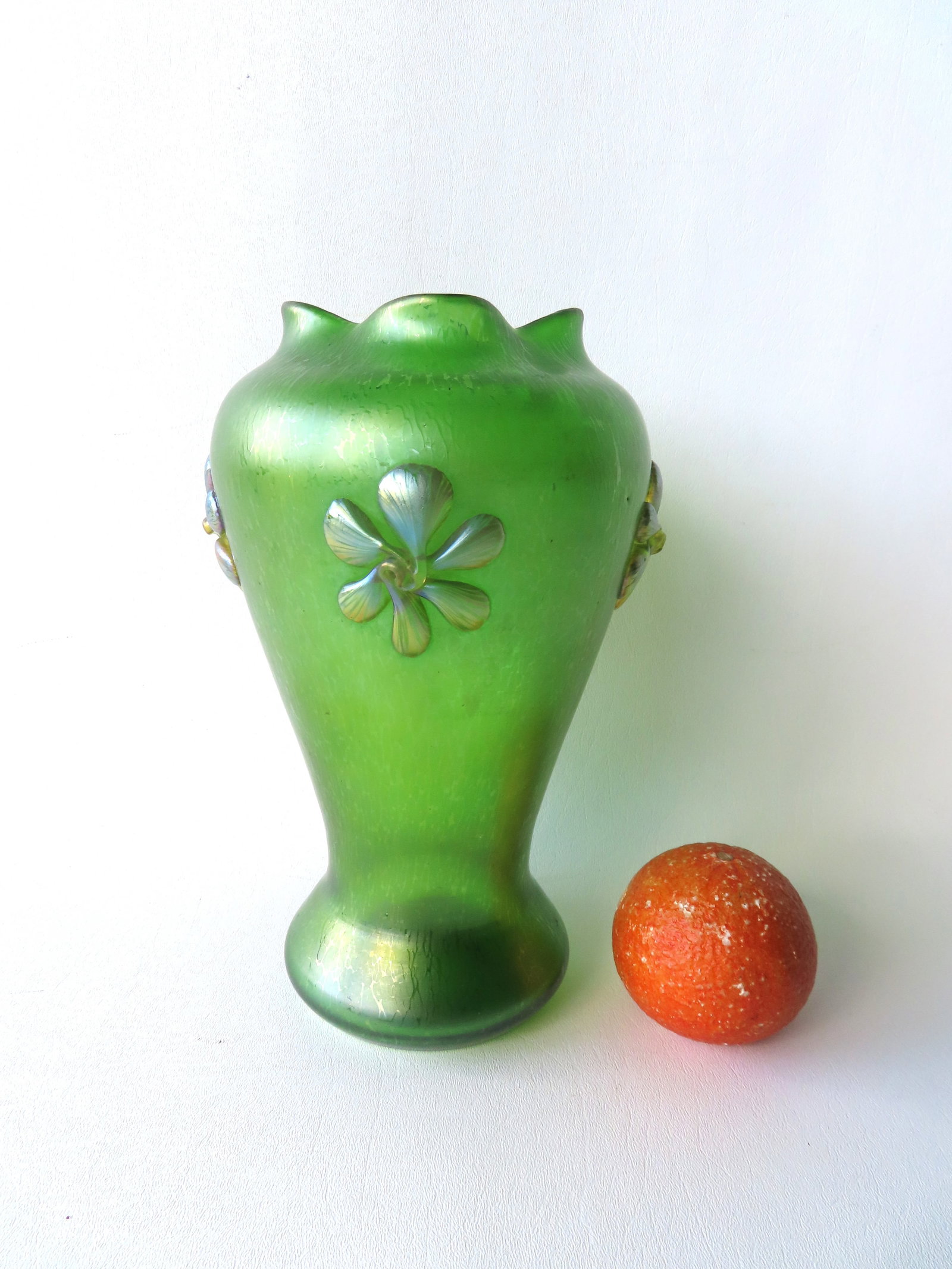An Austrian Art Nouveau style green iridescent vase with applied green flowers, hand blown with: An Austrian Art Nouveau style green iridescent vase with applied green flowers, hand blown with polished pontil, attributed to Wilhelm Kralik, probably early 20th century - measures 10 1/2"H x 6"W. Ve