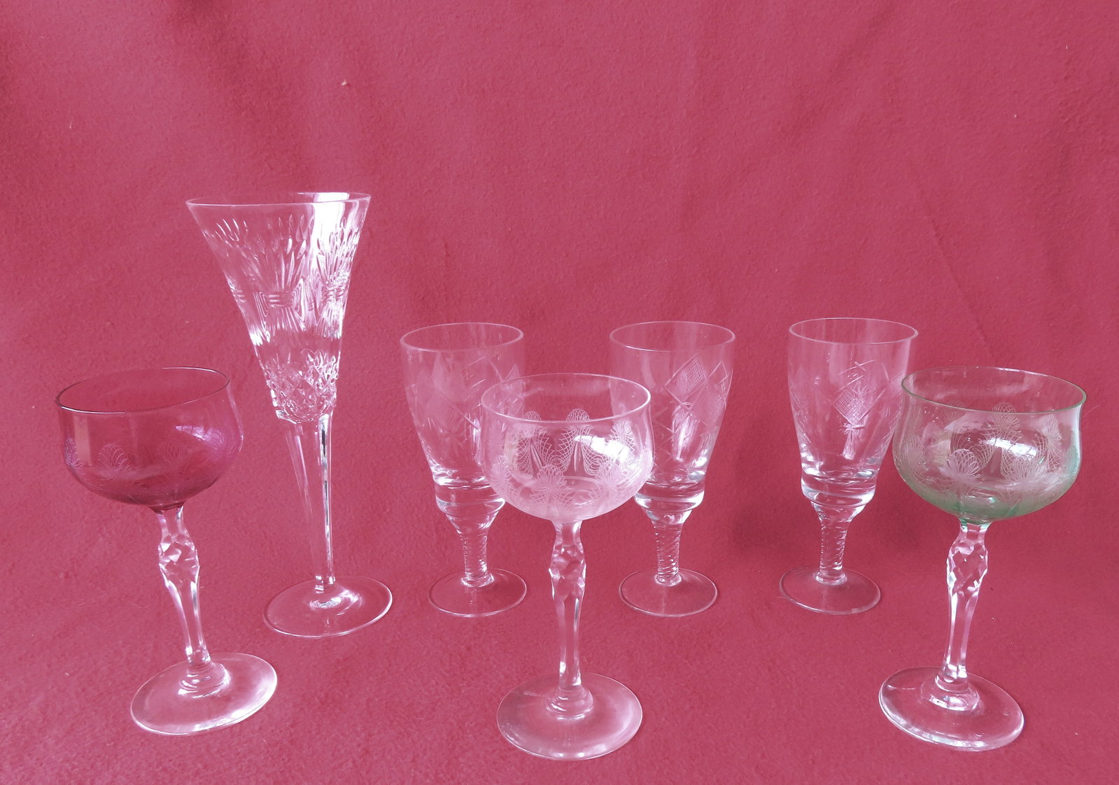 A grouping of 7 pieces of fancy glass stemware including: A large signed Waterford cut glass wine (1 of 14)
