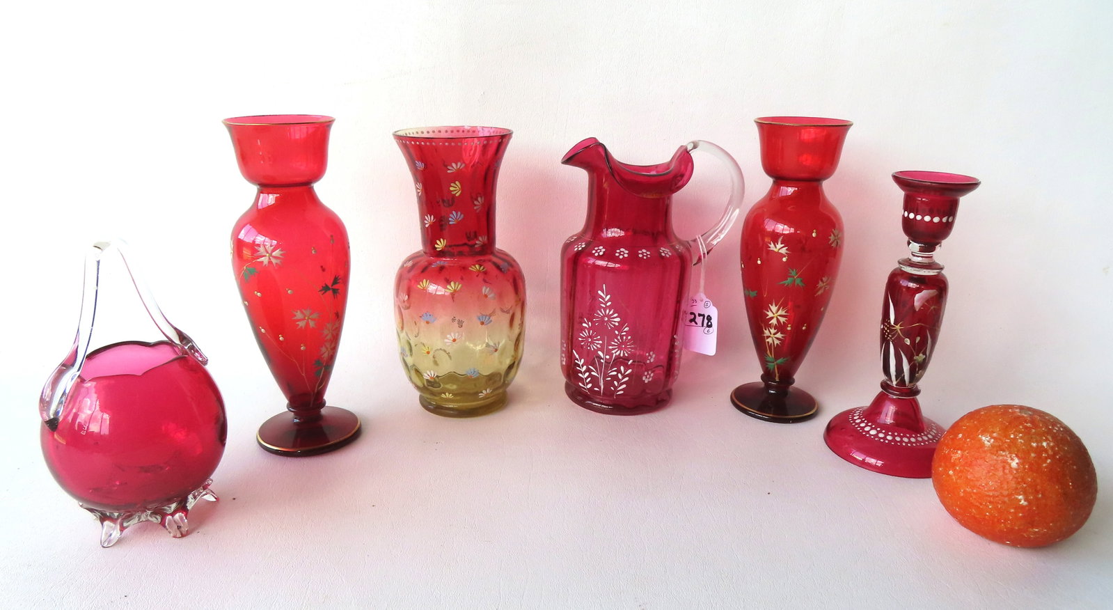 A grouping of 6 pieces of Victorian cranberry glass, 5 decorated with hand painted tiny flowers.: A grouping of 6 pieces of Victorian cranberry glass, 5 decorated with hand painted tiny flowers. Includes 2 matching vases - these are the tallest in this lot measuring 7 3/4"H; an amberina vase with