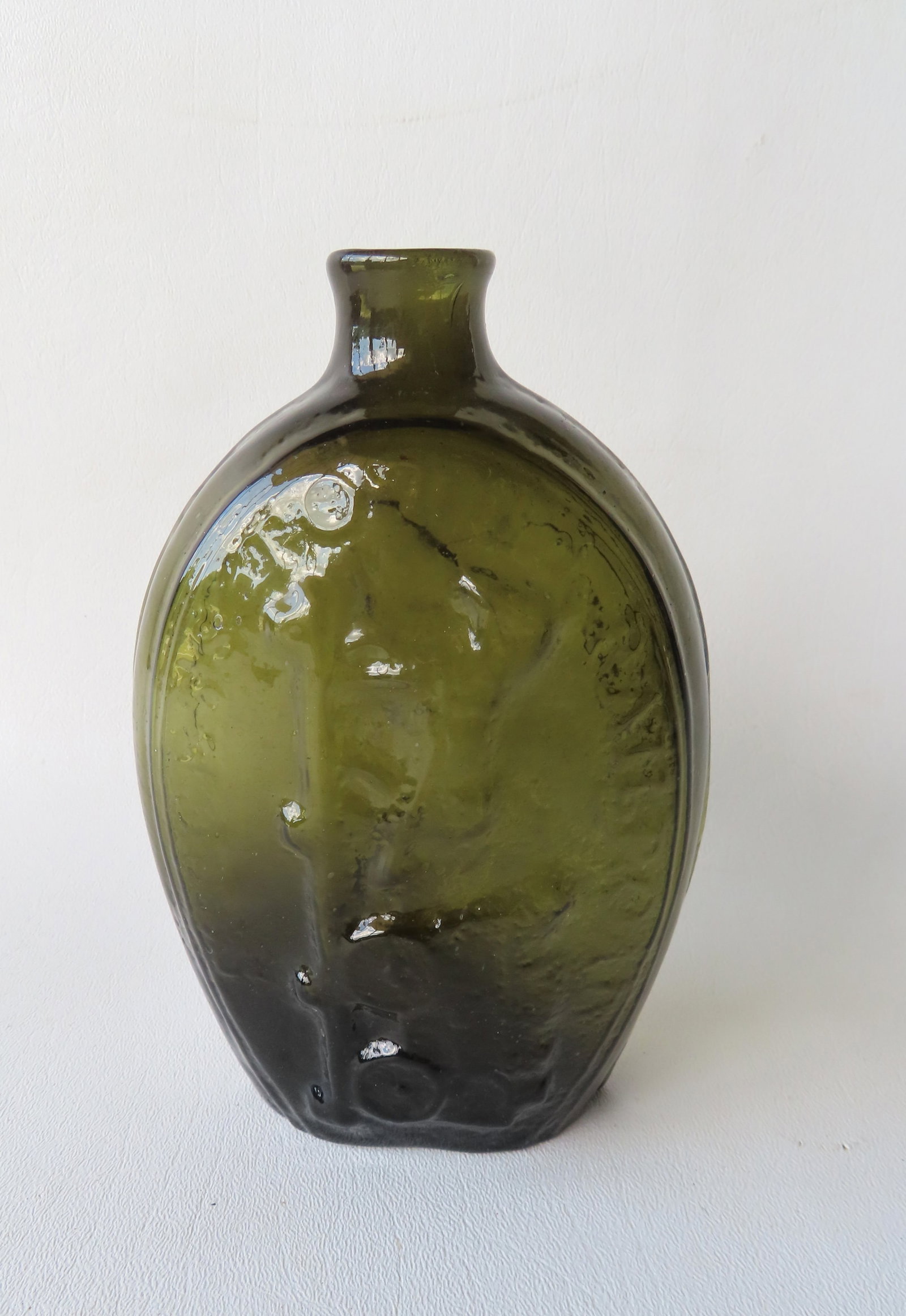 A historical glass flask marked "Success To The Railroad" over embossed horse and cart - embossed (1 of 8)