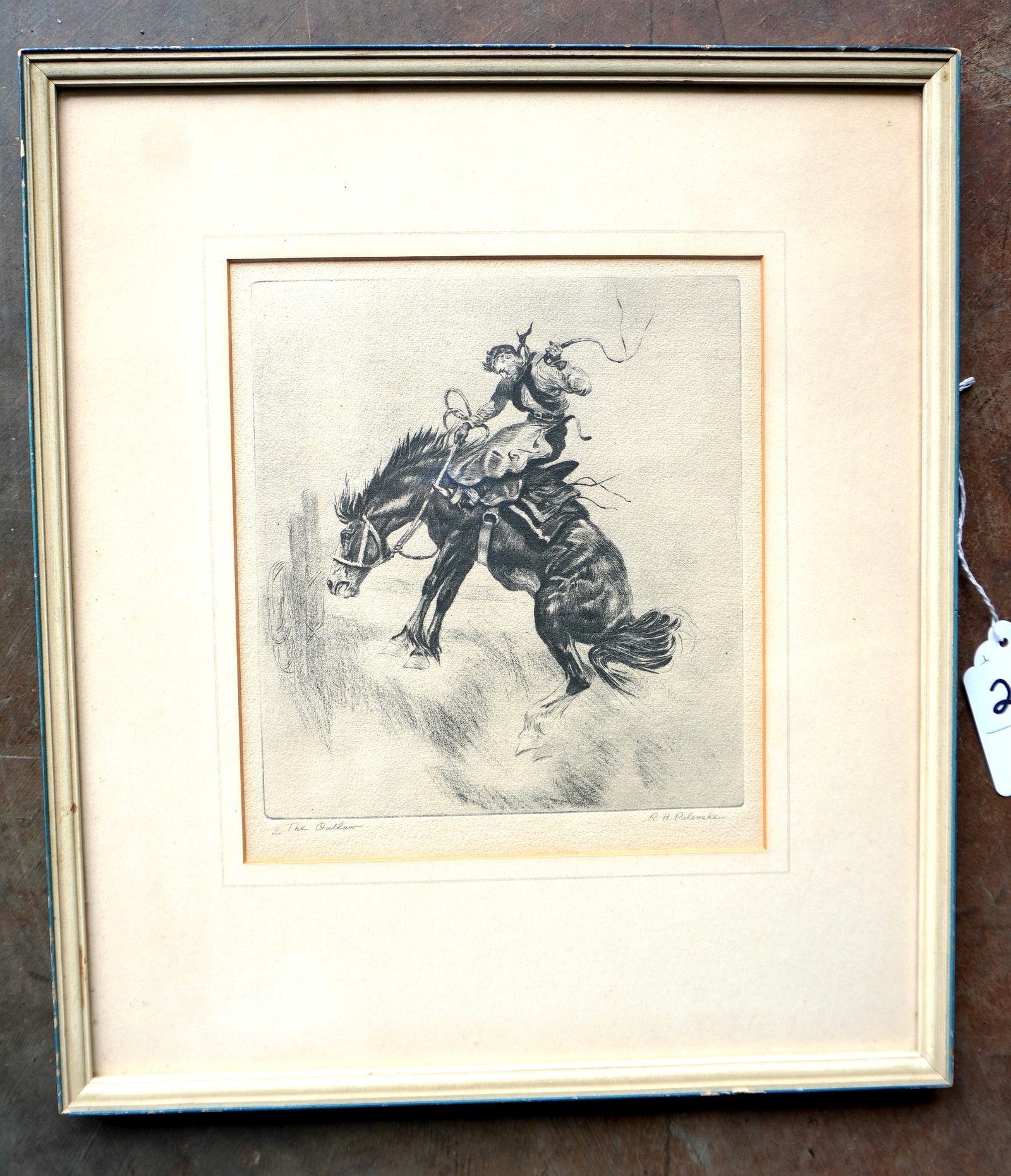 R.H. Palenski, Chicago 1884-1954. Etching titled "The Outlaw" depicting cowboy breaking a horse -: R.H. Palenski, Chicago 1884-1954. Etching titled "The Outlaw" depicting cowboy breaking a horse - pencil signed R.H. Palenski. Very good condition. Total frame size 14 3/4" x 16 3/4" and sight size 8 