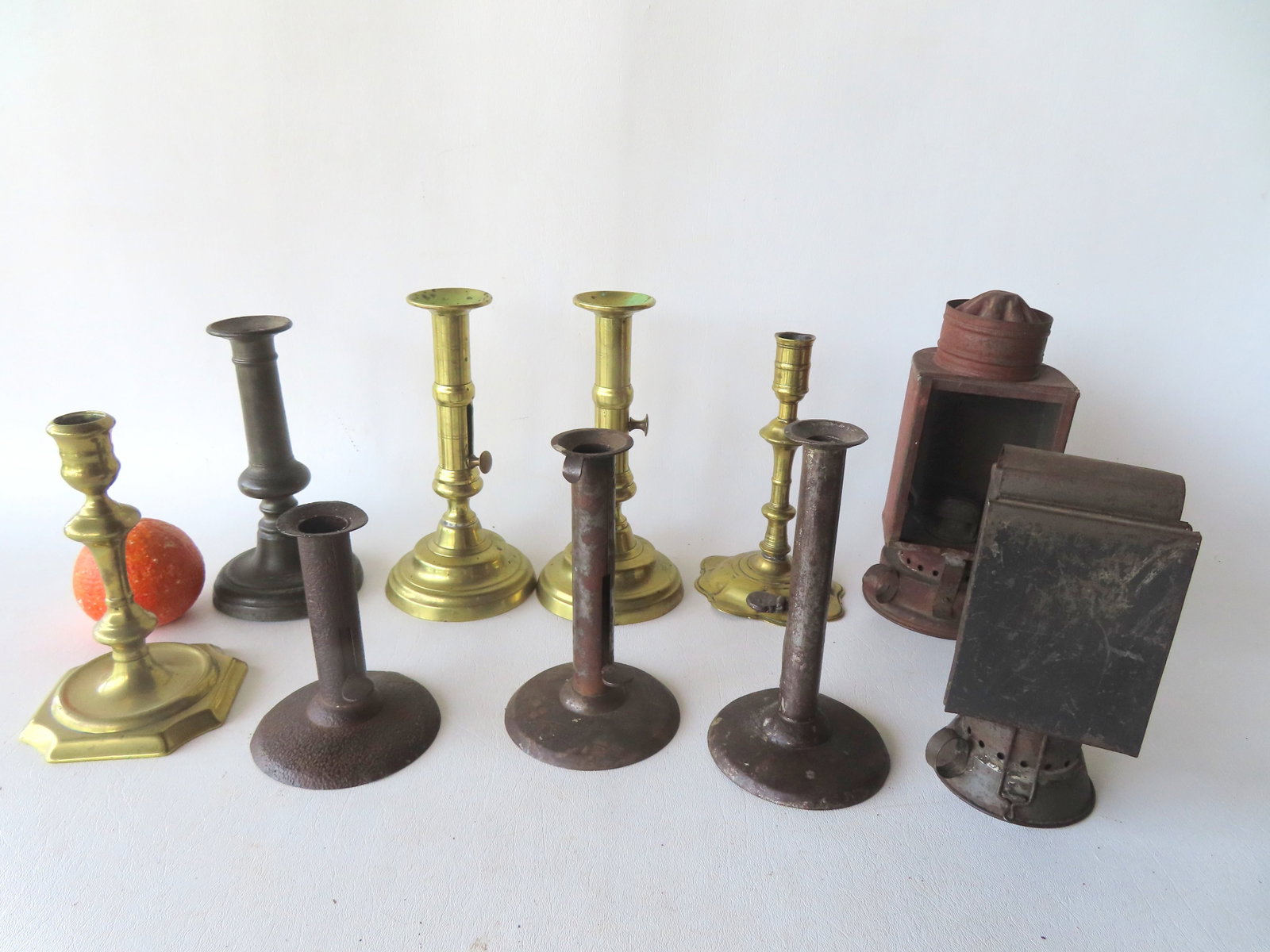 Grouping of 10 early lighting devices including: 3 hog scraper candlesticks, one signed "Shaw's (1 of 11)