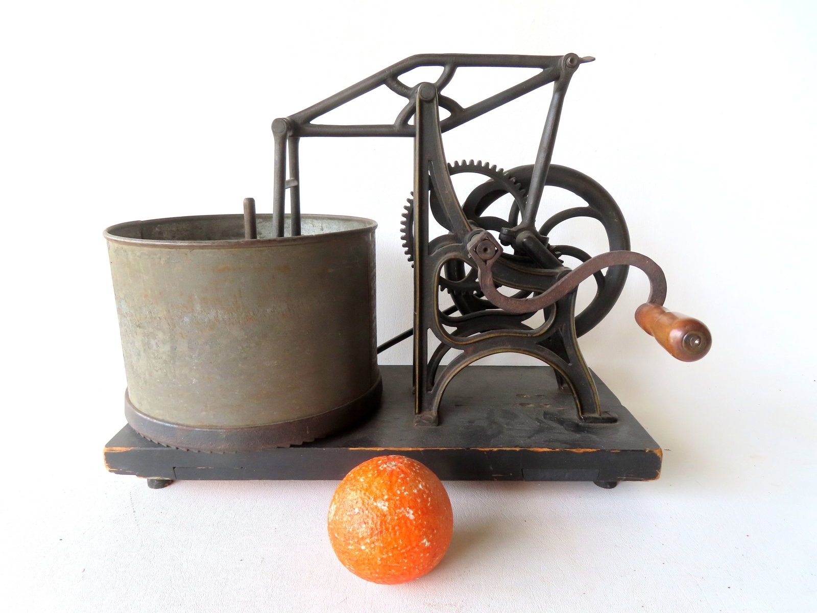 A mechanical hand cranked food chopper in original black paint with yellow stenciling. Late 19th (1 of 10)