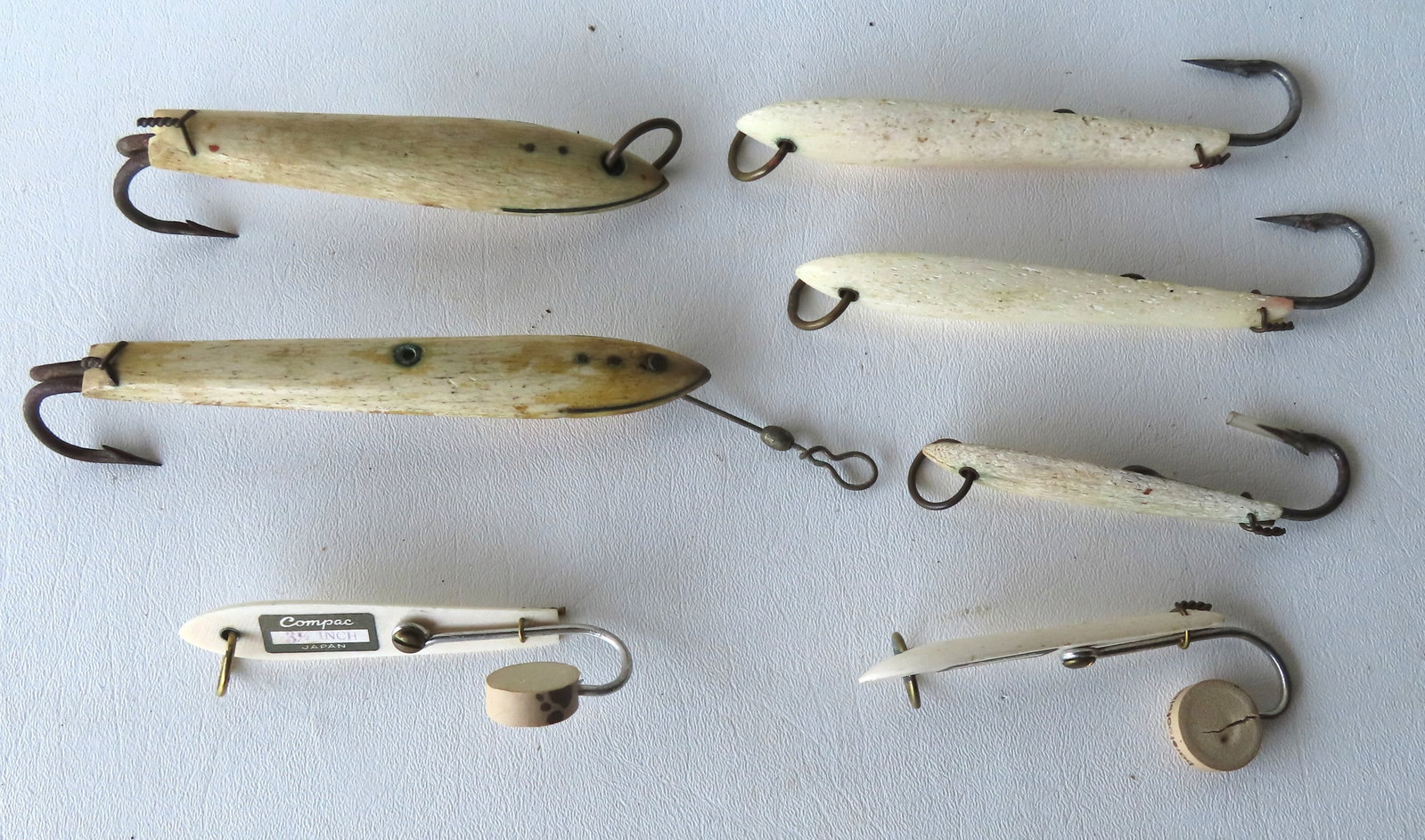 Grouping of fishing lures, most in bone, some signed Japan, early to mid 20th century. All in good (1 of 3)