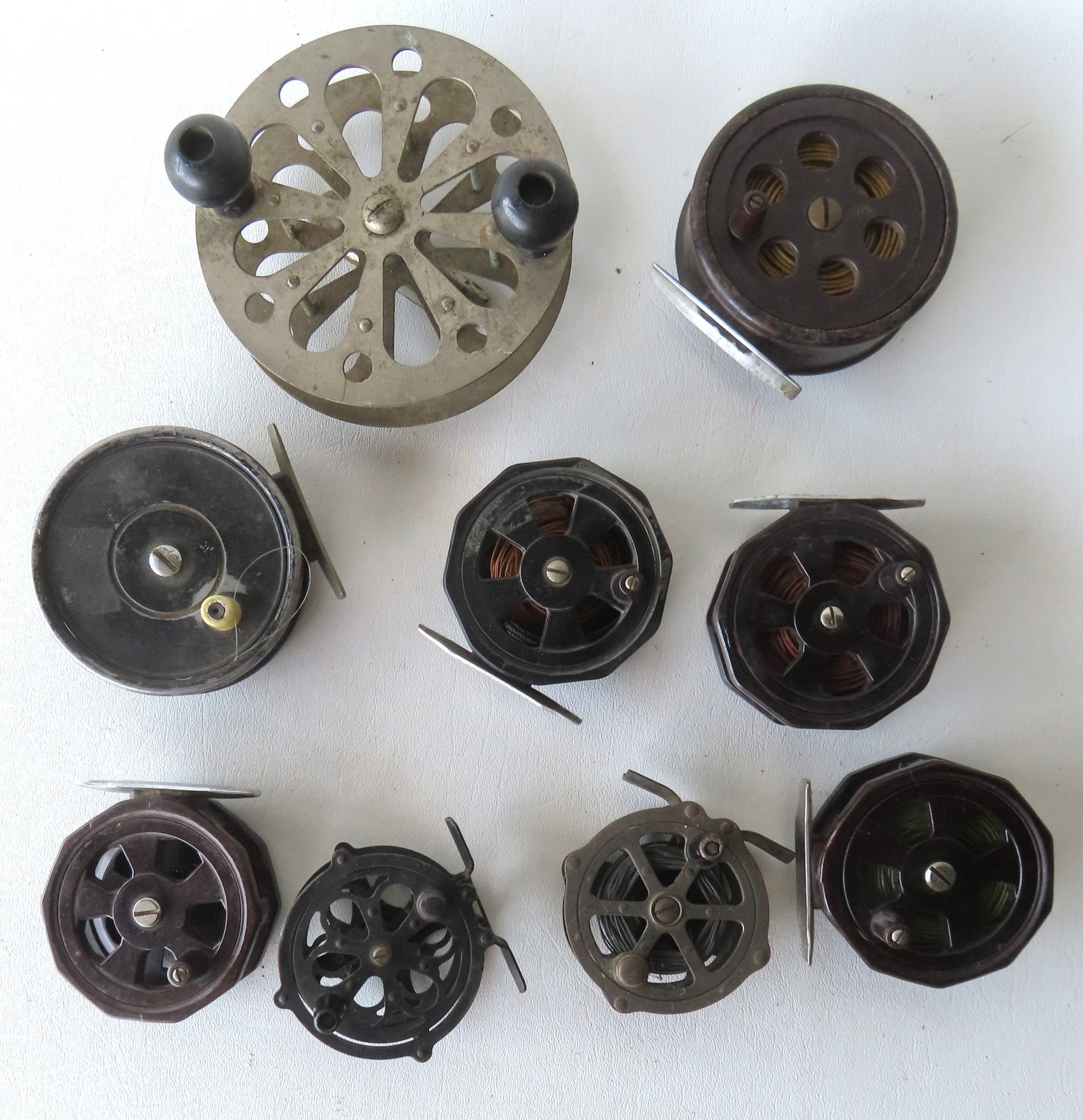 Grouping of 9 vintage fishing reels, most fly fishing - all used but in good condition; together (1 of 8)