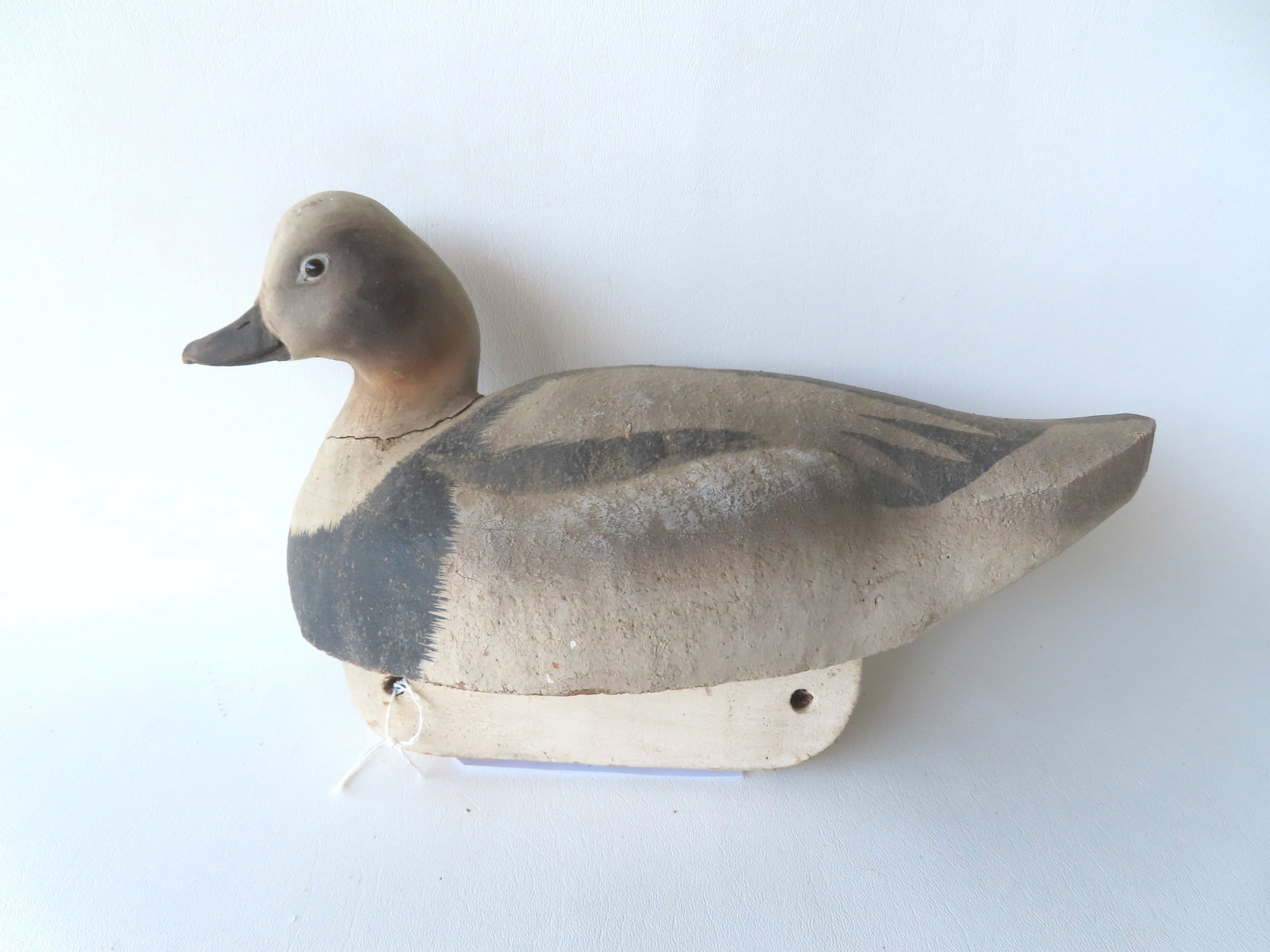 Bob Hand, Sag Harbor NY, 1943-2021. Carved and hand painted cork decoy with wood head, glass eyes, (1 of 6)