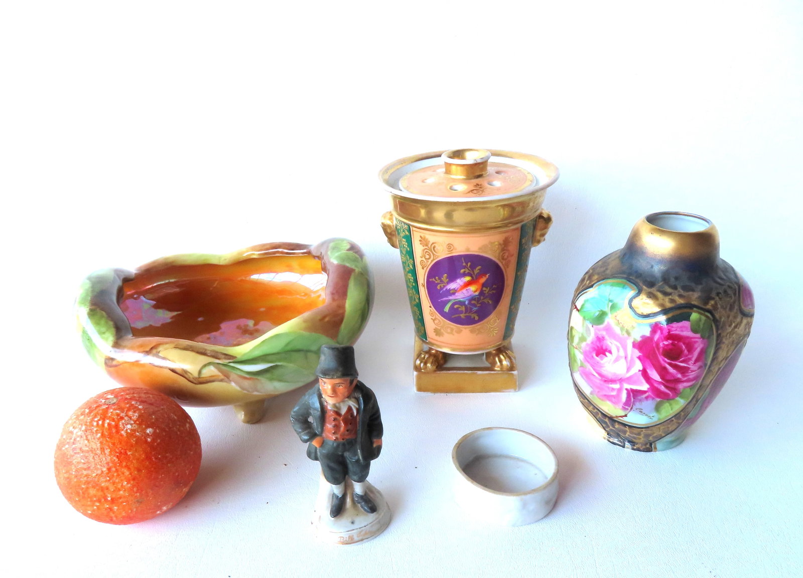 Grouping of 4 porcelain collectibles, including: The first, a classical vase decorated with very (1 of 20)