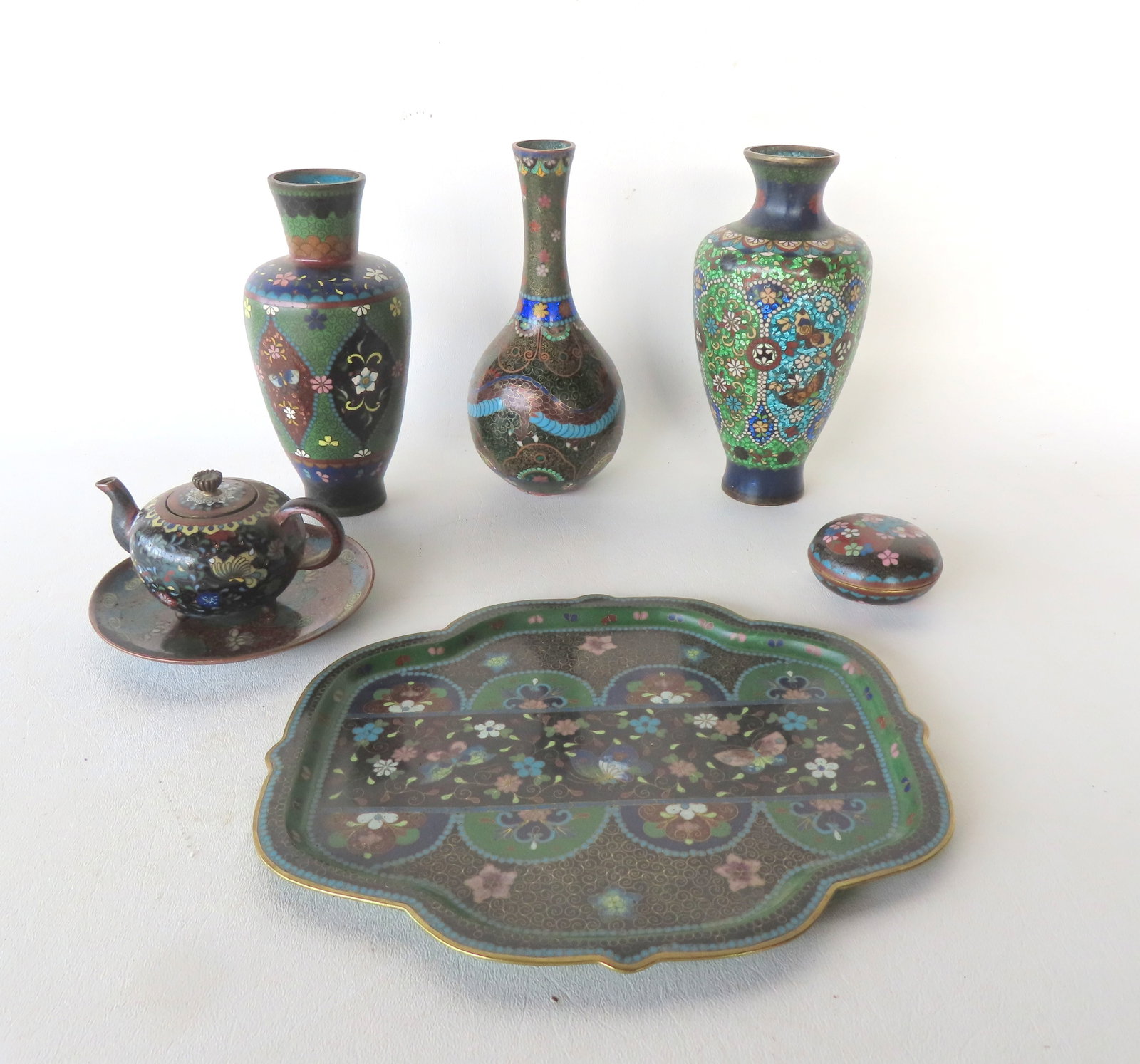 A grouping of 7 pieces of vintage cloisonn? articles including: Two vases decorated with flowers,: A grouping of 7 pieces of vintage cloisonn? articles including: Two vases decorated with flowers, one with small dent on underside edge of base, else both in very good condition - the largest 7 1/4"H;