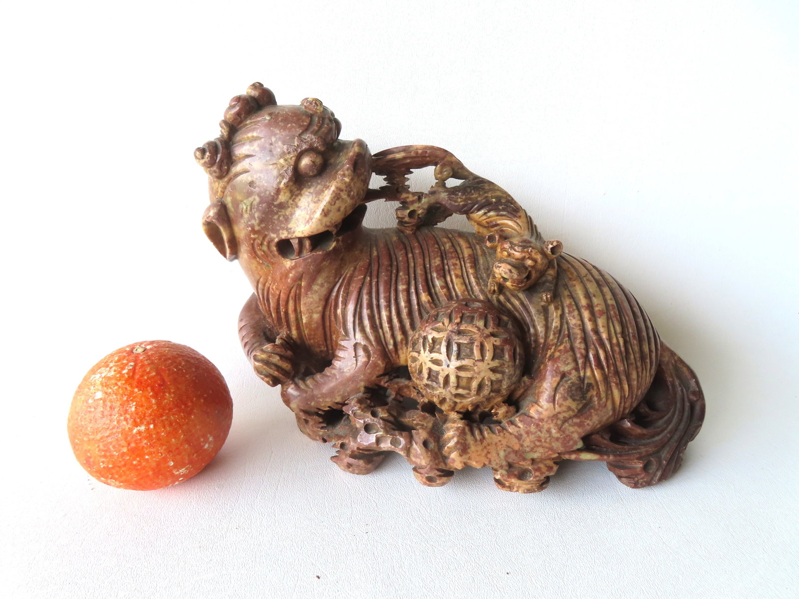 A very fine large soapstone sculpture of Chinese foo dogs depicting a playful pup on mom's back,: A very fine large soapstone sculpture of Chinese foo dogs depicting a playful pup on mom's back, 19th century in very good condition. Measures 10 1/2"W x 4"D x 7 1/2"H.