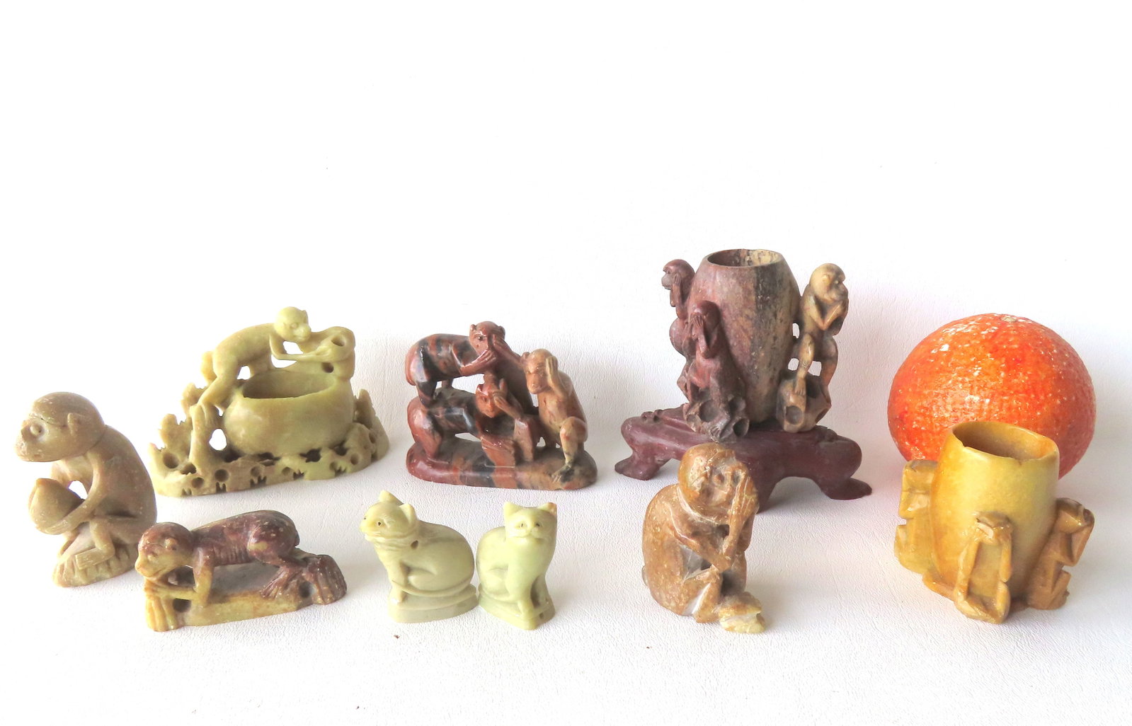 Grouping of 9 small oriental soapstone figures/vases including 7 monkey figures - one of the small (1 of 14)