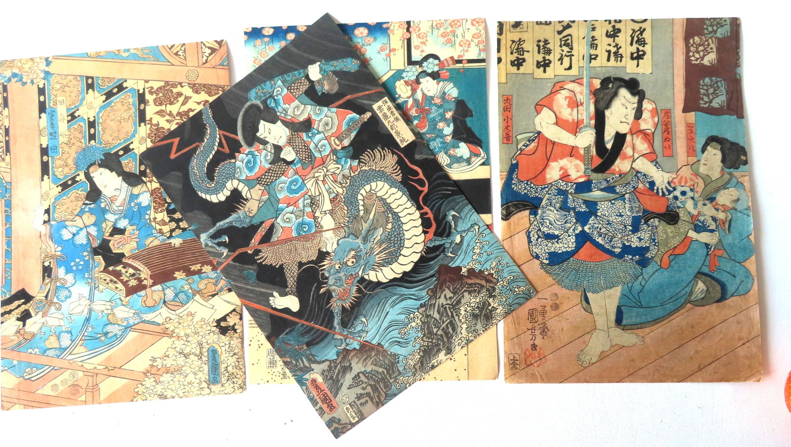 Grouping of 4 Japanese woodblock prints including: Utagawa Kunisada, titled "Unry? Kur? Kagezumi: Grouping of 4 Japanese woodblock prints including: Utagawa Kunisada, titled "Unry? Kur? Kagezumi Commanding the Dragon" - very good condition; Utagawa Kunisada, titled "Magical March of Origami Frogs,