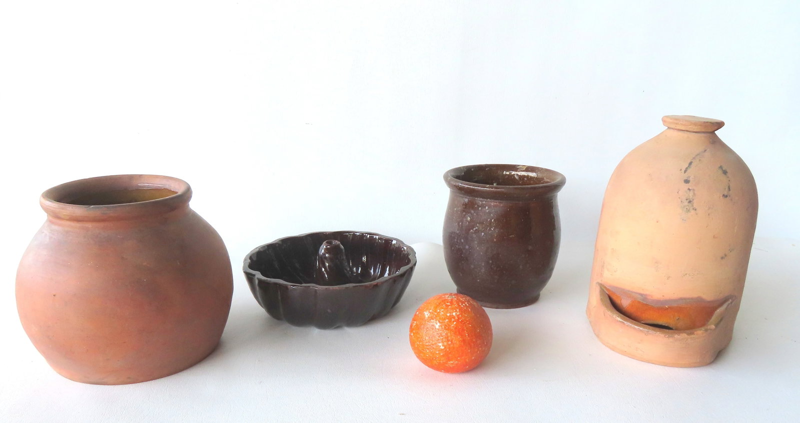 Four pieces of redware including: Jar with rolled lip with manganese glaze - good condition; redware (1 of 7)