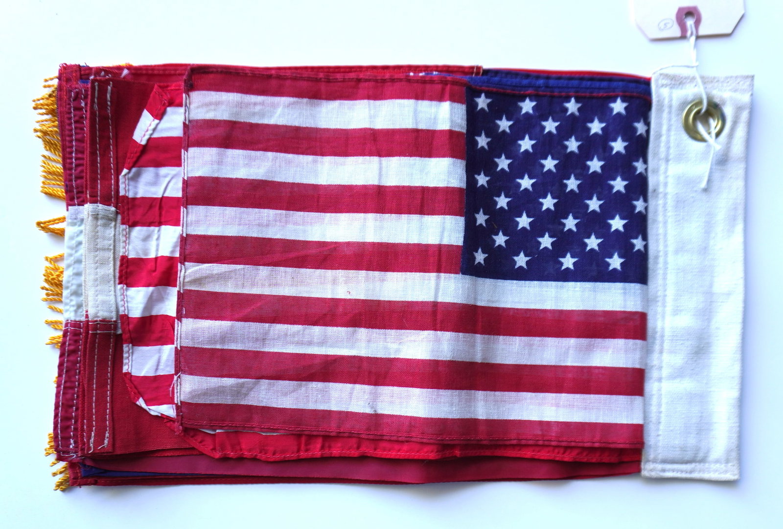 A set of 10 salesman sample flags/banners, all believed to be American, including two stamped "Bull (1 of 11)