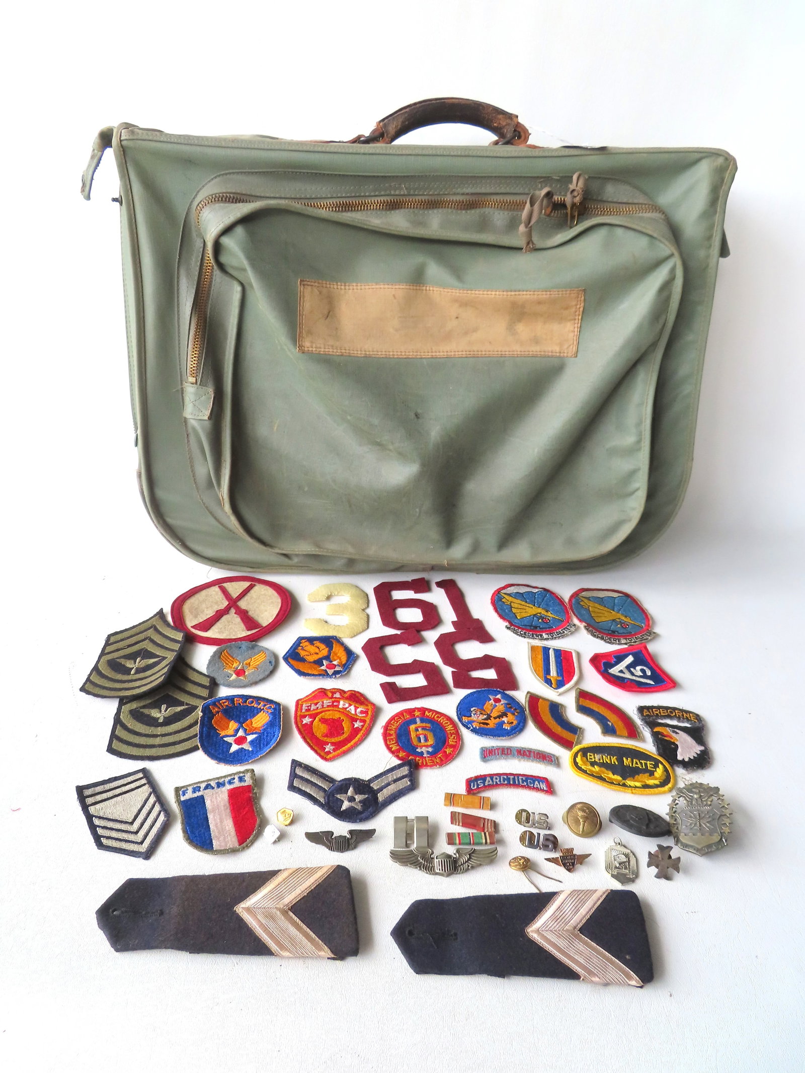 Grouping of military badges and patches, most Air Force related, and 1 German military pin; together (1 of 9)