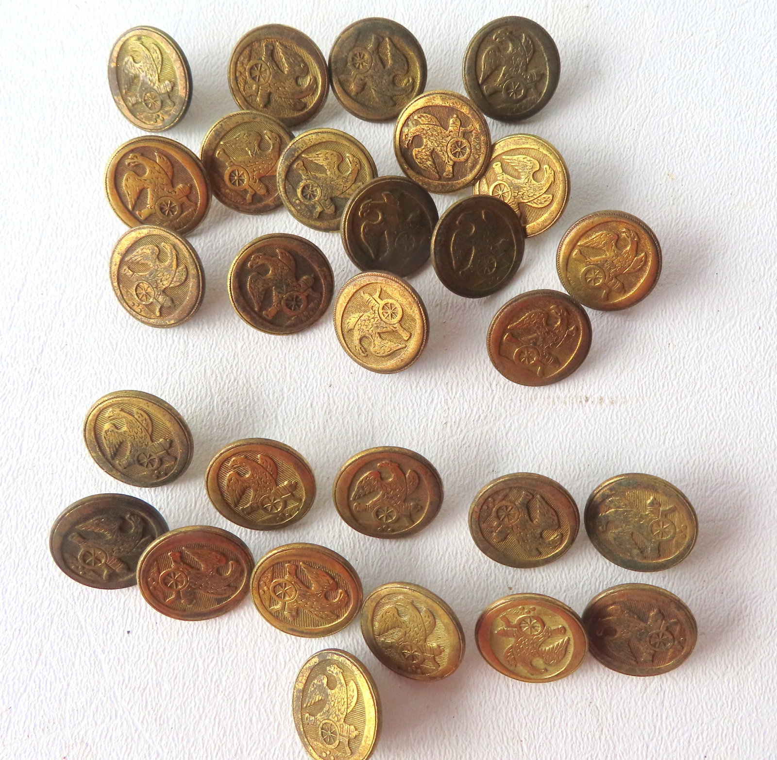 Grouping of 28 military buttons, eagle over cannon, marked on reverse "Treble Standard Gilt" (12 (1 of 6)