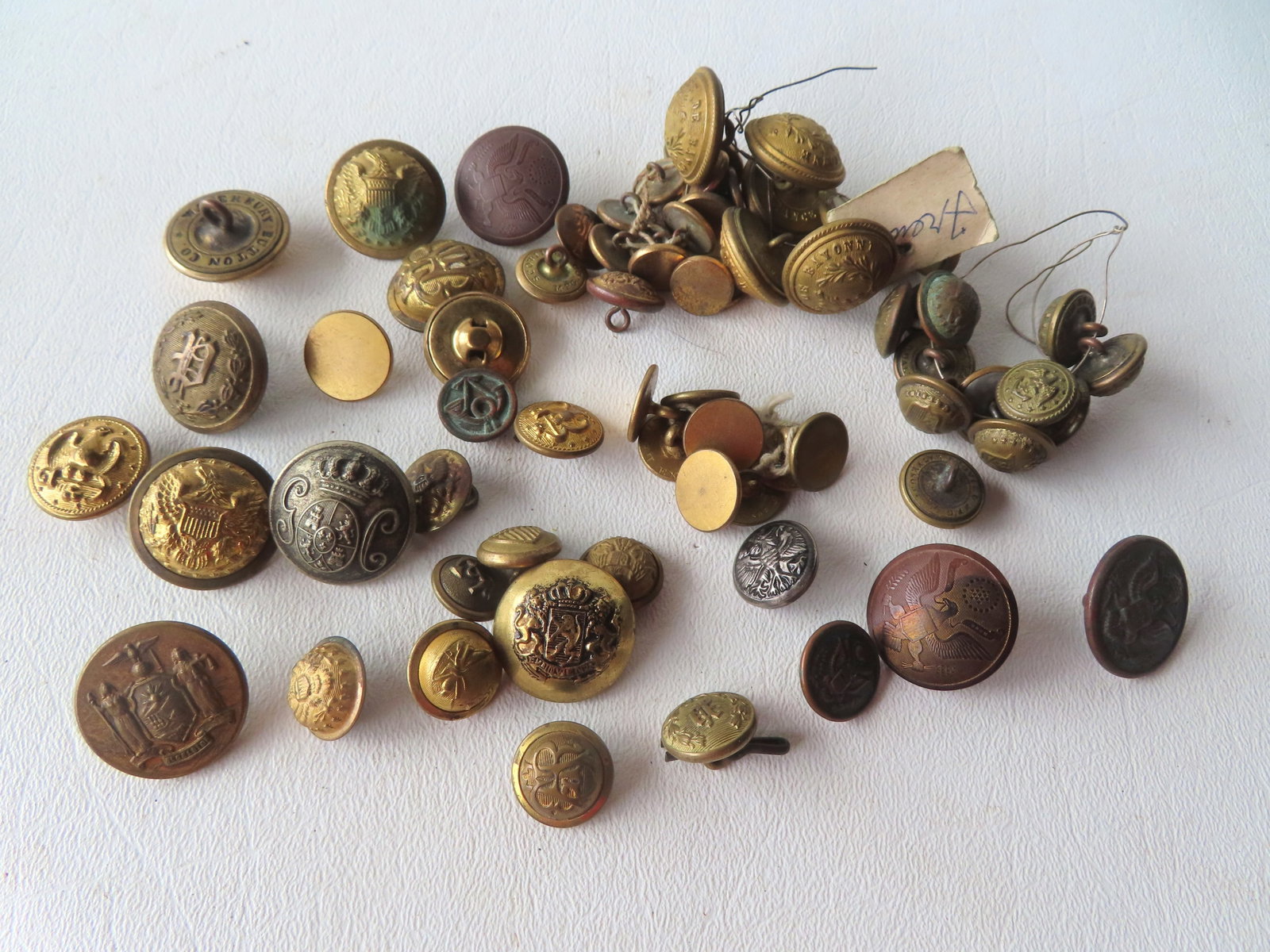 A large grouping of military and other uniform buttons, early 19th and 20th century. Please see (1 of 5)