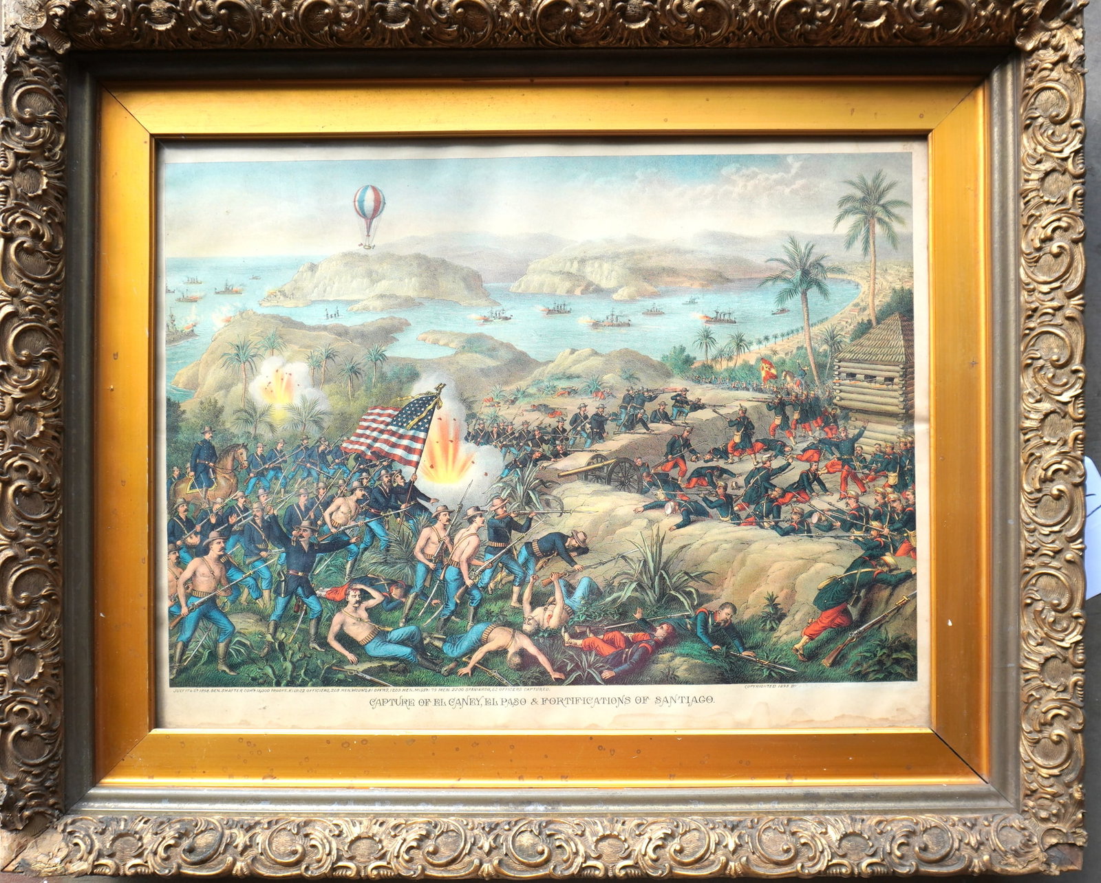 Large folio Spanish American War chromolithograph, titled "Capture of El Caney, El Paso, And: Large folio Spanish American War chromolithograph, titled "Capture of El Caney, El Paso, And Fortifications of Santiago" published by Kurz & Allison 1898. Note that some of the printed material bottom