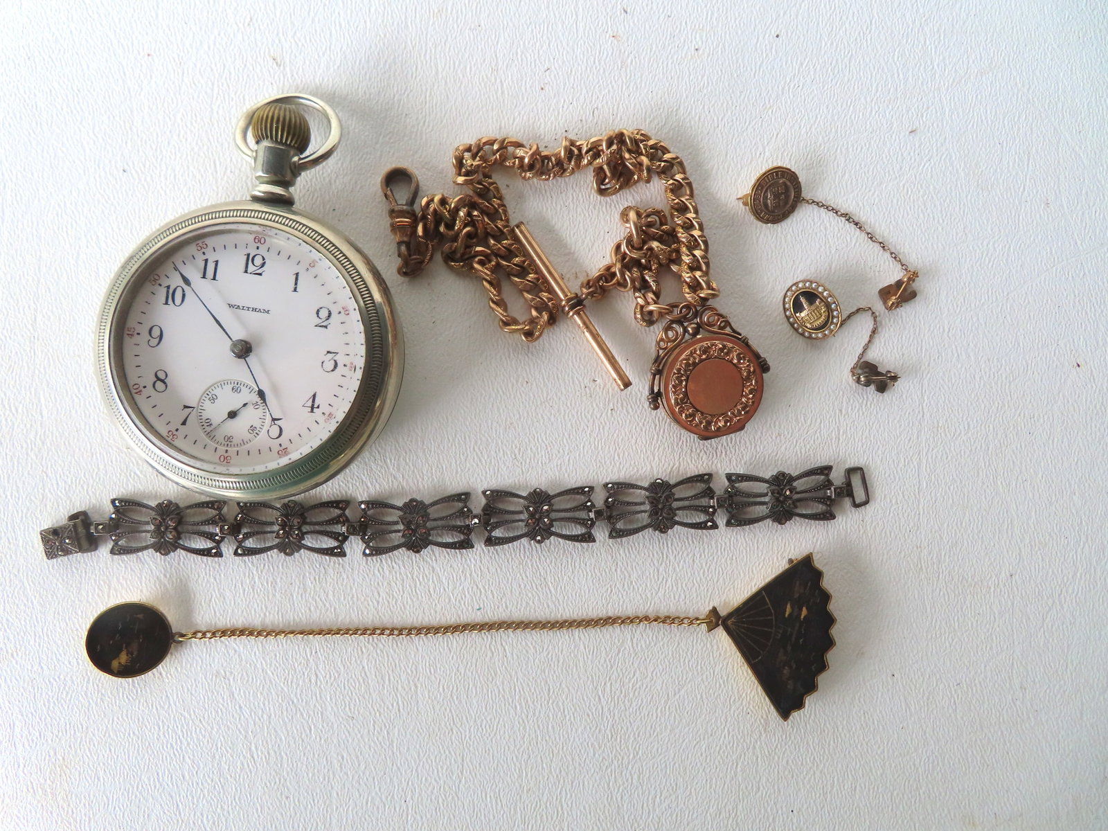 Grouping of vintage jewelry and pocket watch including: Two 10k gold gent's tie pins with tiny (1 of 11)