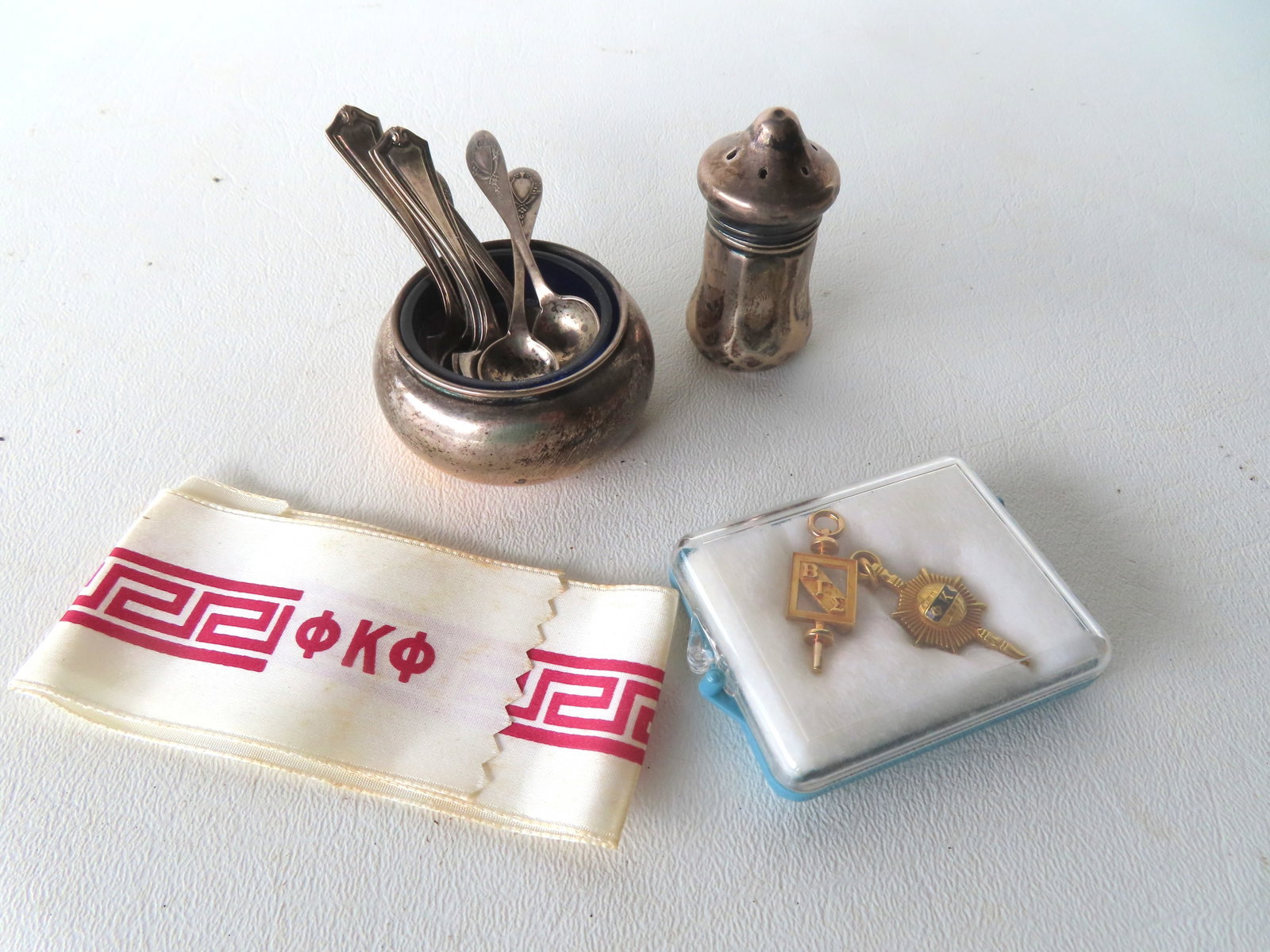Small grouping of sterling and gold fraternal pins, including: A 10k gold pin - weighs 2 grams; an (1 of 5)