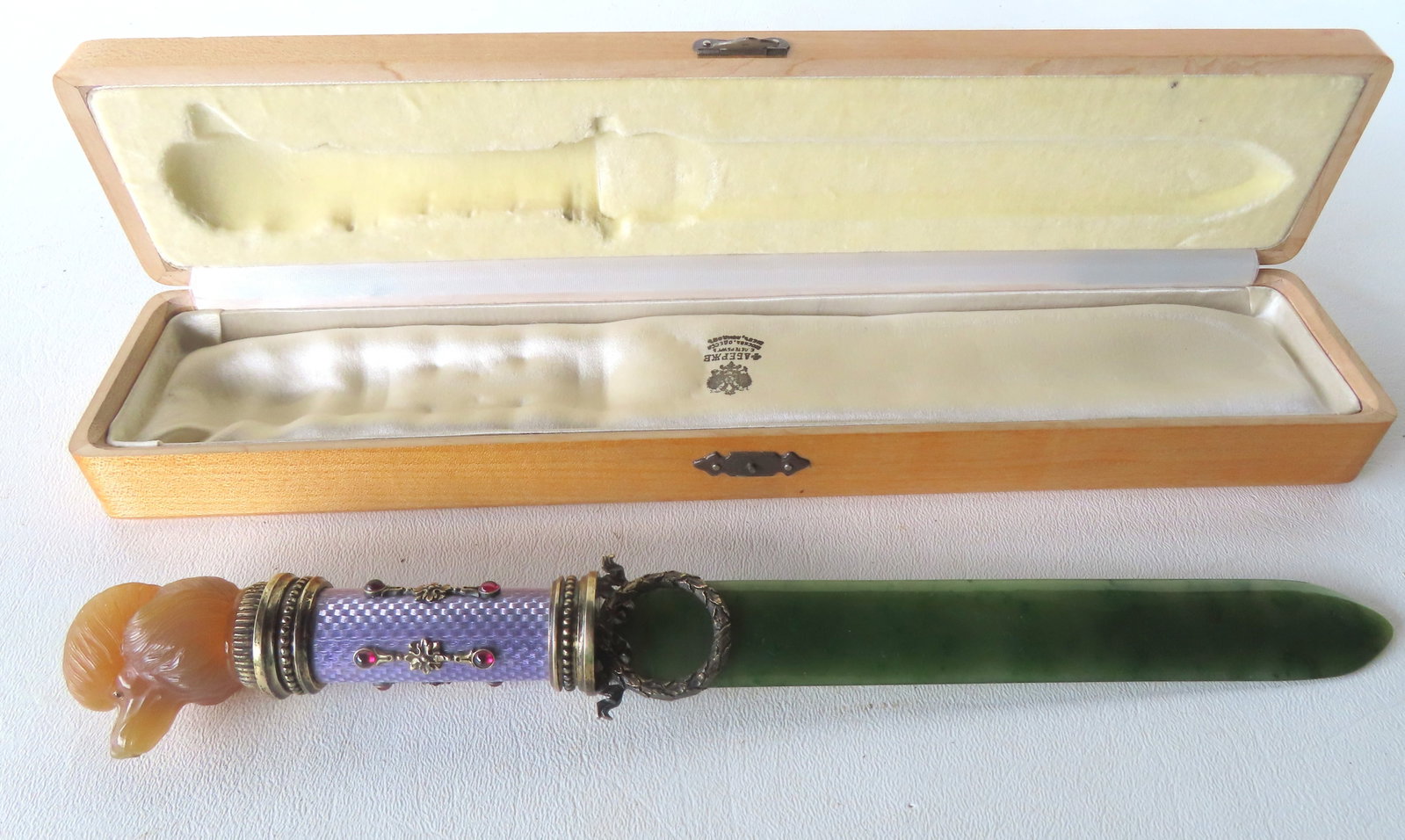 An extremely fine Russian letter opener, in the style of Faberge's master craftsman Henrik Wigstrom, (1 of 8)
