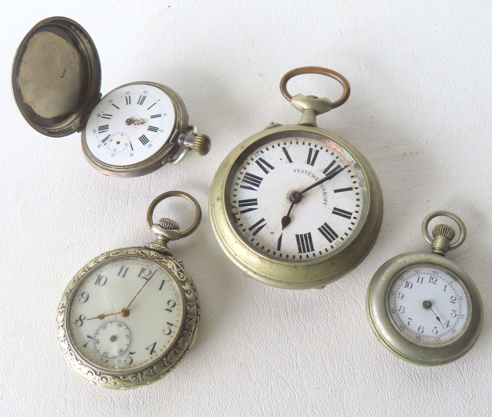 Grouping of 4 vintage pocket watches including: A fancy open face pocket watch, decorated in silver (1 of 18)