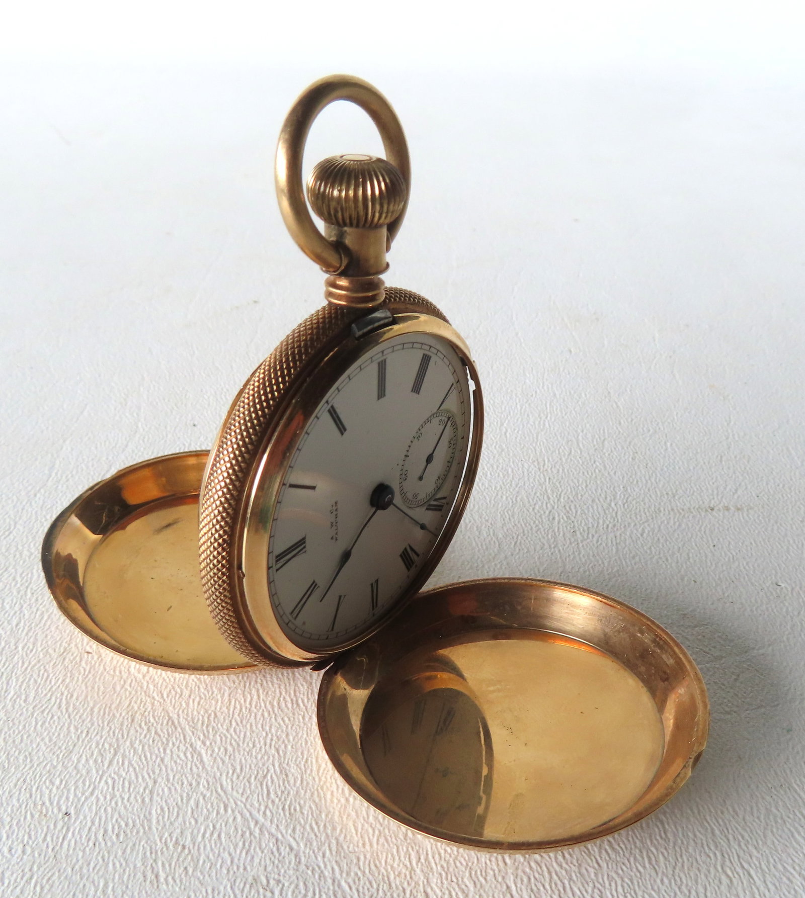 A 14k gold hunter case pocket watch signed on face A.W. Waltham Co., marked on reverse "14K" - also (1 of 10)