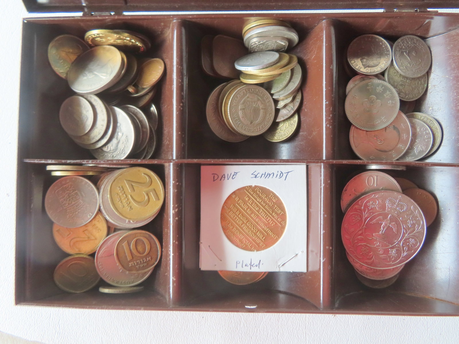 A large grouping of mostly vintage foreign coins, all circulated in various conditions, some (1 of 9)