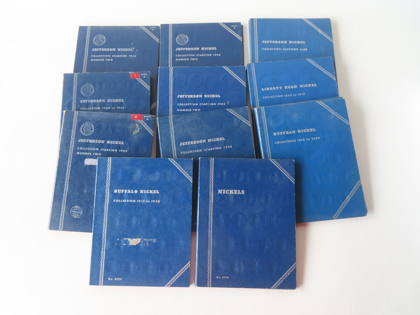 A grouping of American nickles housed in 11 collector booklets, some Whitman books, containing (1 of 17)