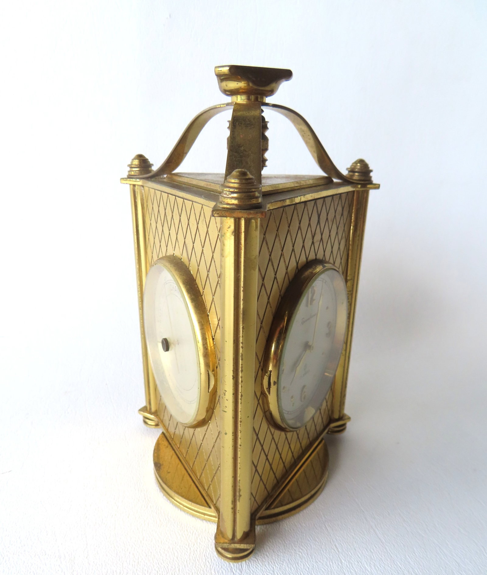 A Swiss made 3 face Remembrance clock on revolving base,with windup clock, barometer and thermometer: A Swiss made 3 face Remembrance clock on revolving base,with windup clock, barometer and thermometer featured on 3 faces. The barometer and thermometer appear to maintain correct temperatures and pres