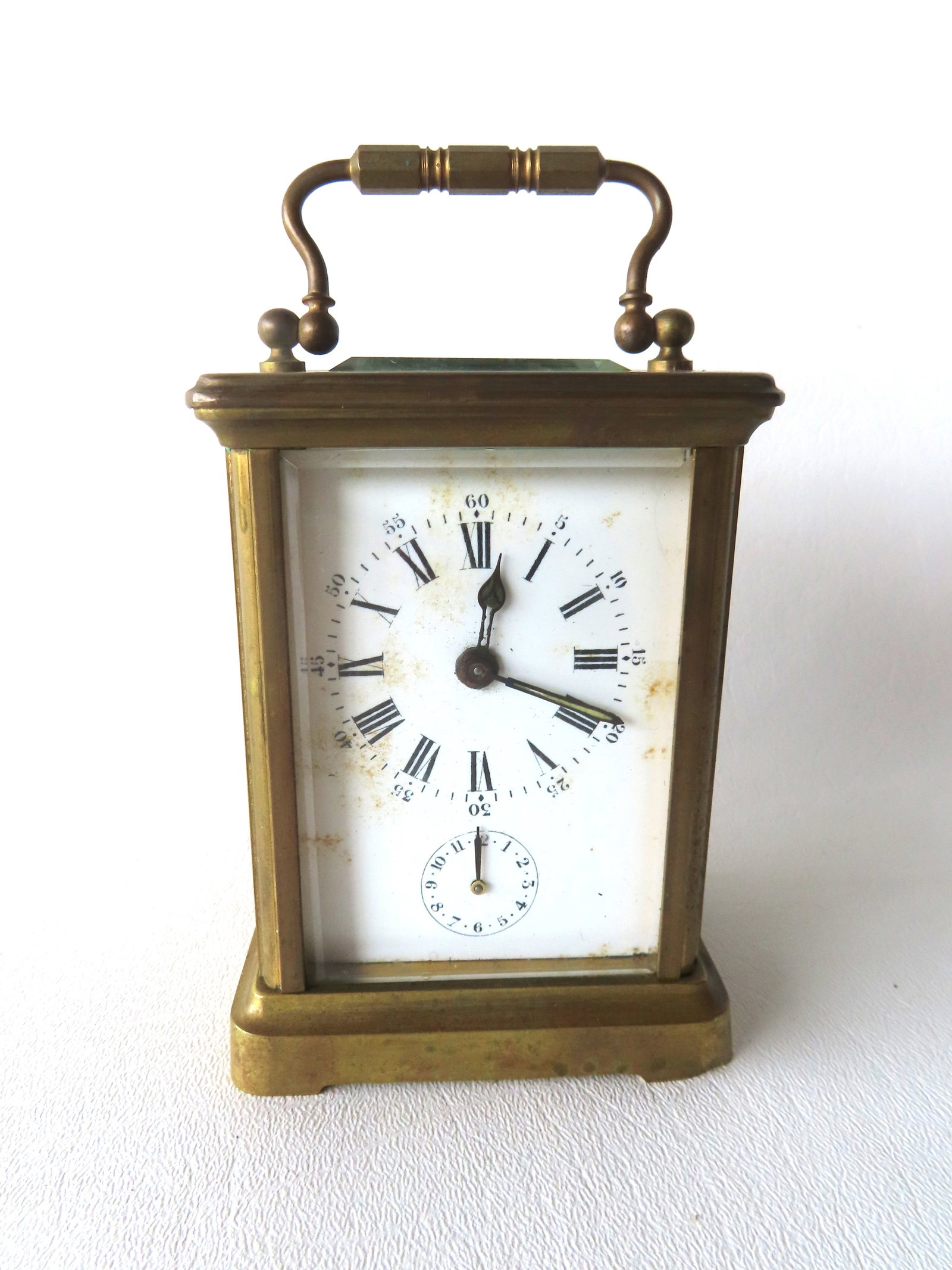 A French carriage clock with alarm, glass sides, brass frame. Has been packed away for many years so (1 of 4)