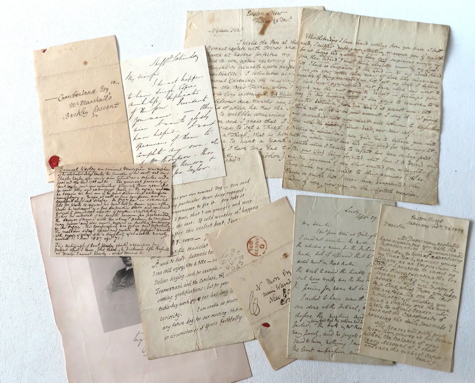 A grouping of 10 letters and notes related to the prominent English composer and organist, Samuel: A grouping of 10 letters and notes related to the prominent English composer and organist, Samuel Wesley (1766?1837), together with autographed engraving of a stately gentleman (signature illegible). 