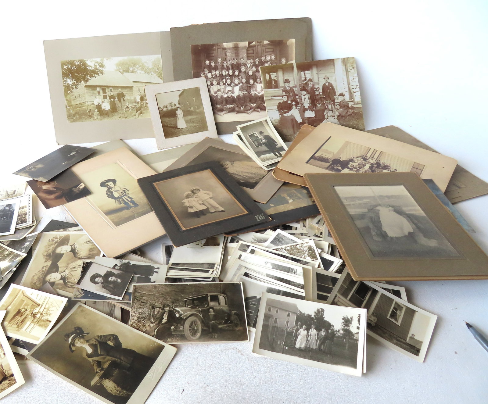 Large grouping of vintage photos, circa 1880-1940. Includes many with ladies in Victorian and: Large grouping of vintage photos, circa 1880-1940. Includes many with ladies in Victorian and Edwardian costumes, 3 ladies sitting on fenders of auto, nurse photo, family portraits in front of farm ho