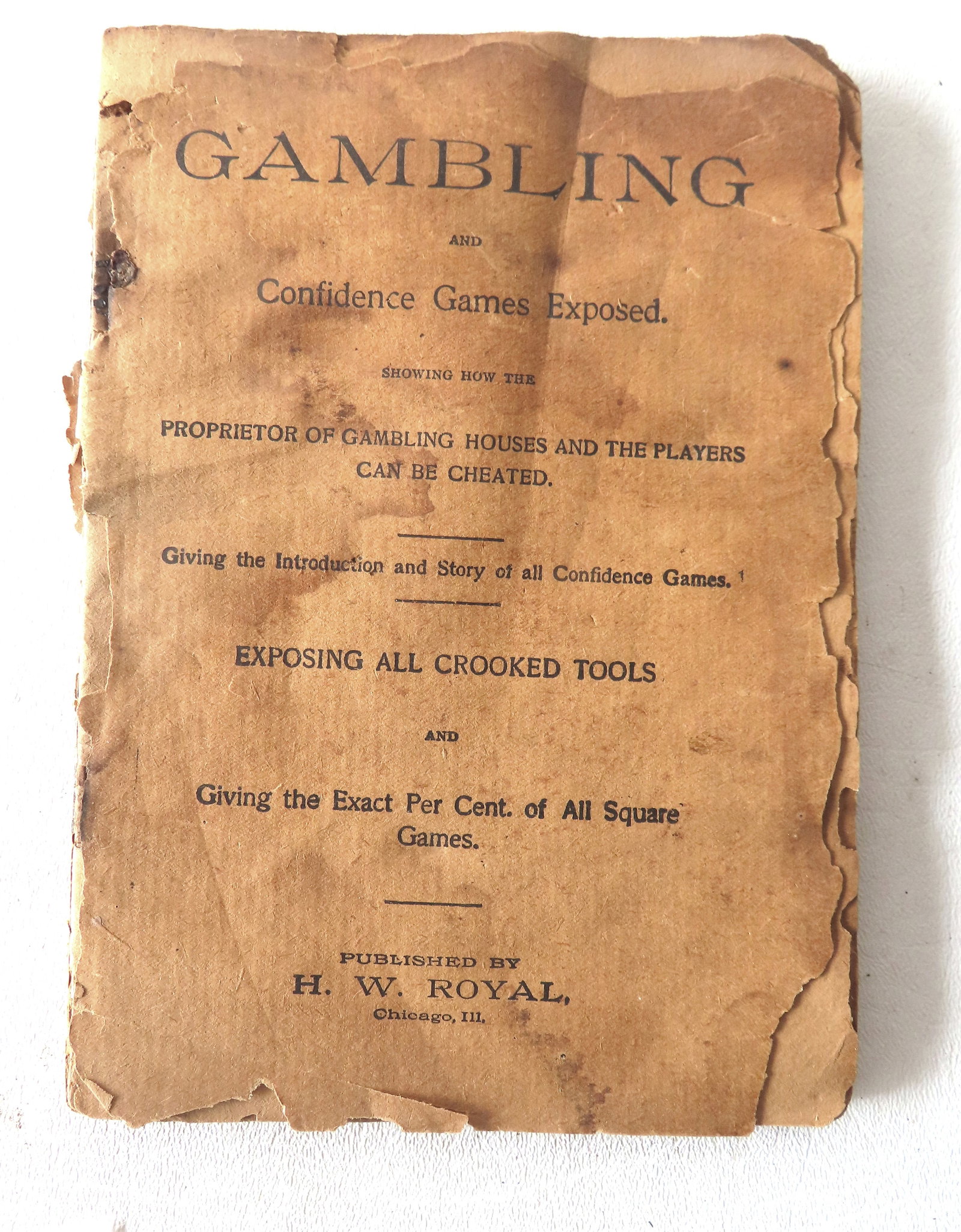 Booklet titled "Gambling And Confidence Games Exposed.". Published by H.W. Royal, 1896. Complete but: Booklet titled "Gambling And Confidence Games Exposed.". Published by H.W. Royal, 1896. Complete but in fair condition with loose front and back paper covers, but with edge losses.