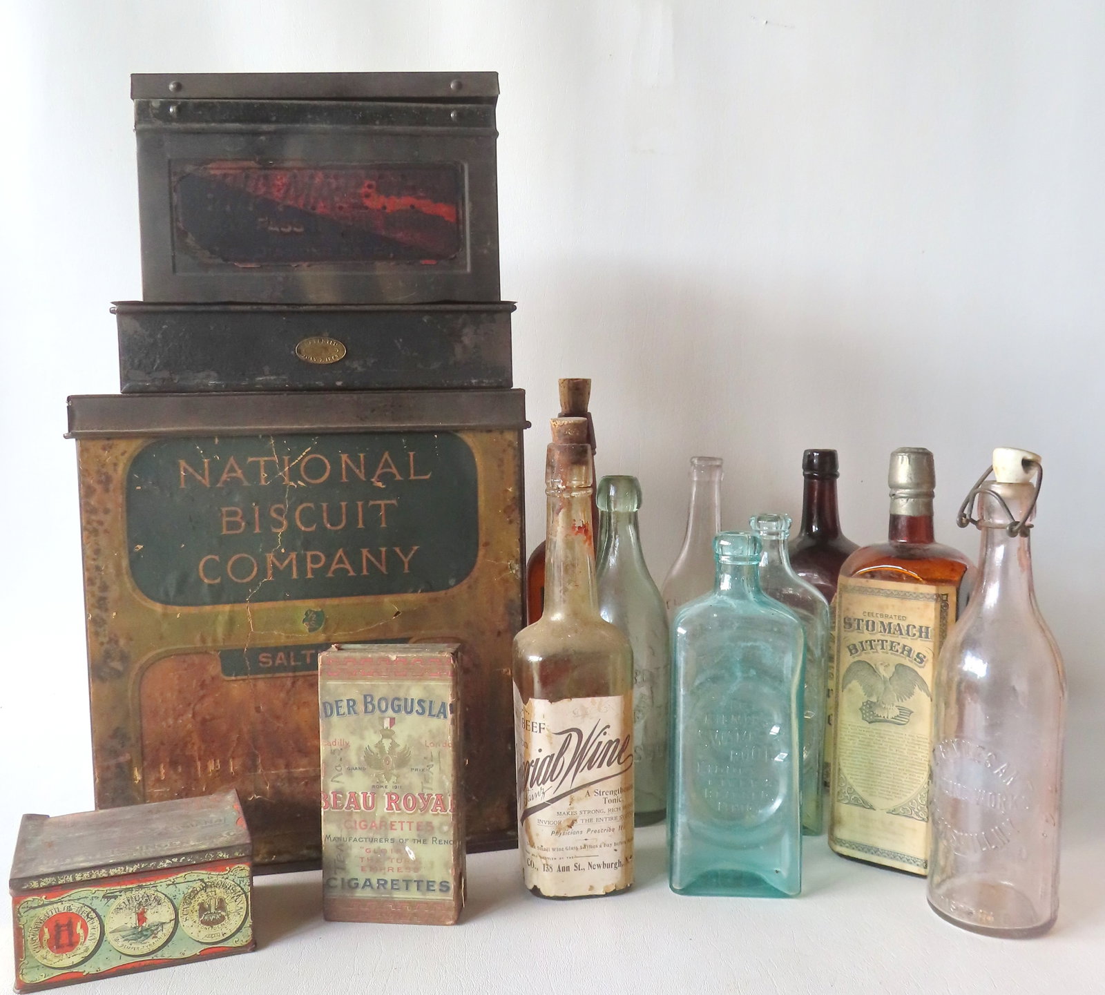 A grouping of mostly vintage advertising tins and bottles, most late 19th to early 20th century. (1 of 20)
