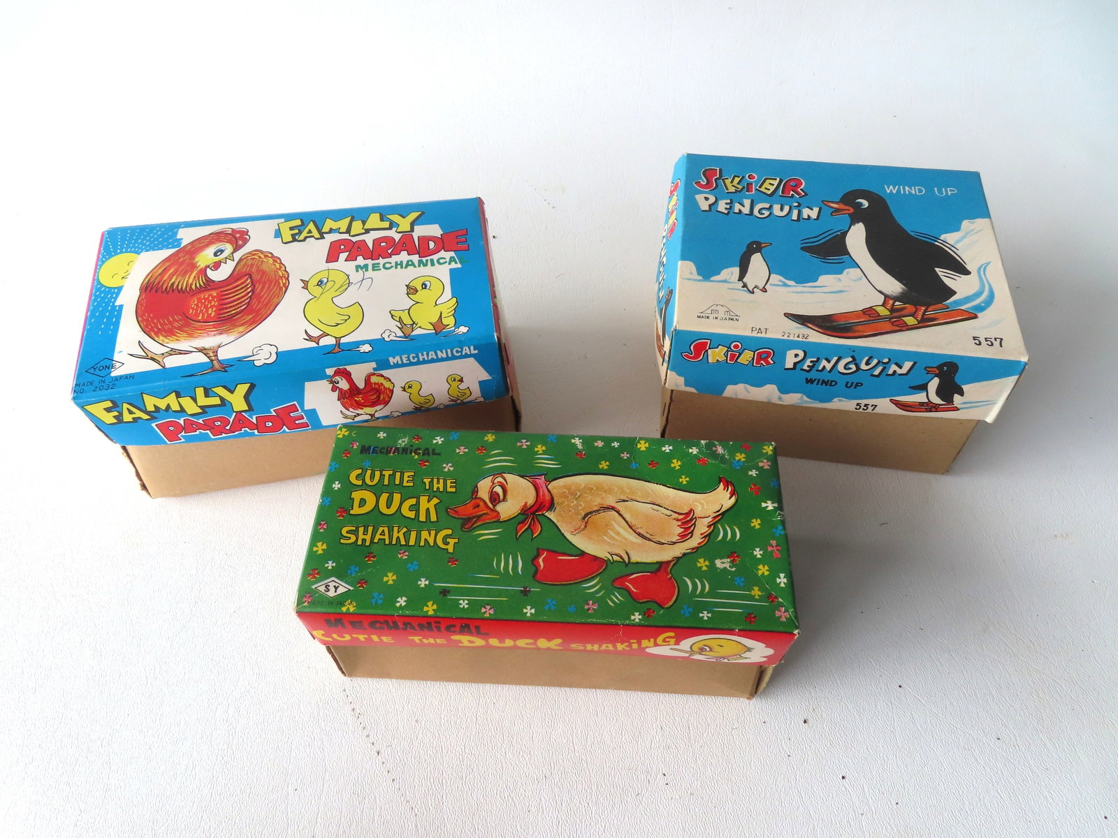 Three Japanese windup articulated toys in original boxes, circa 1950-60. Includes: "Skier Penguin" (1 of 11)